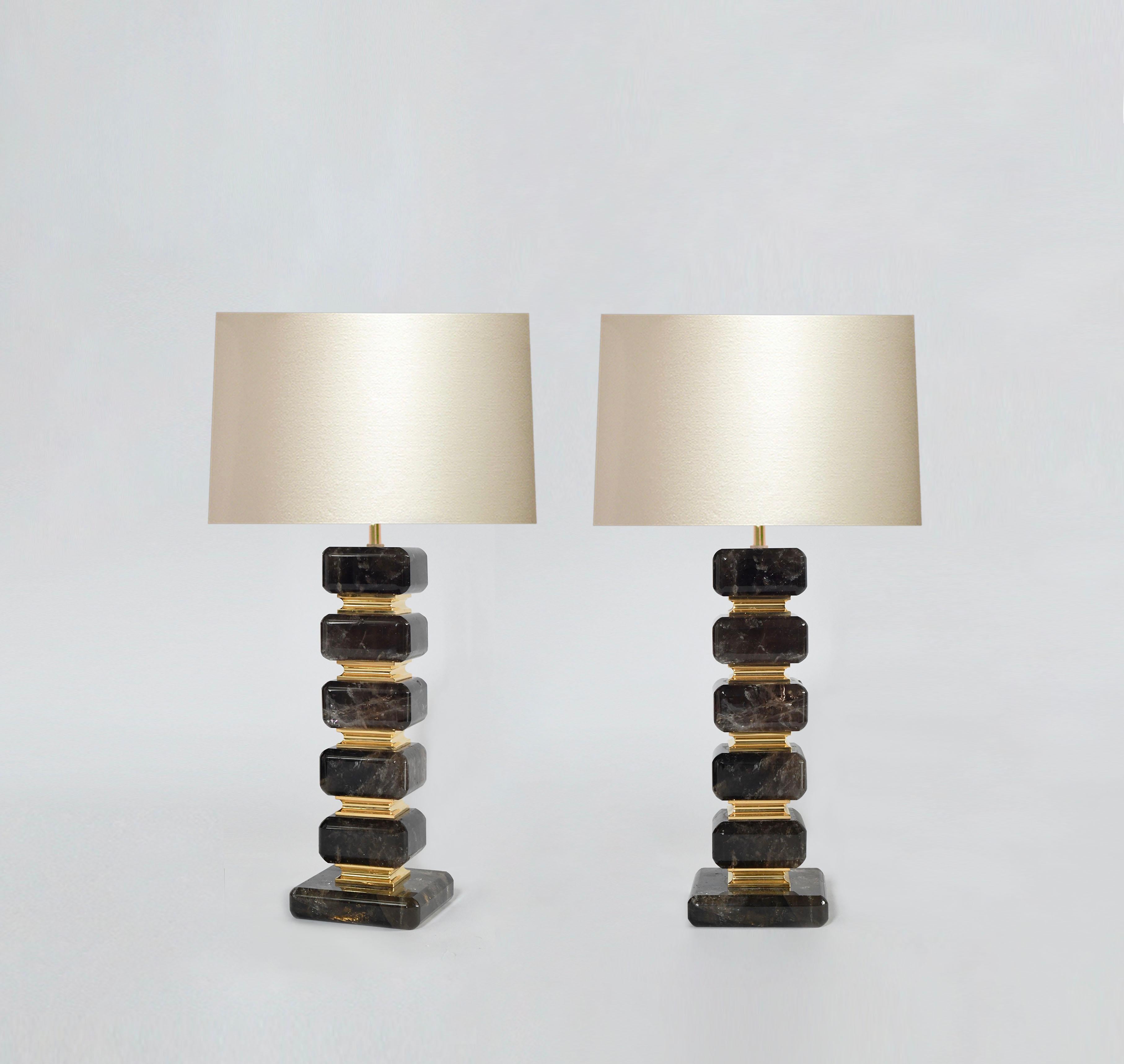 Cubic with beveled edge smoky rock crystal table lamps with brass insert decoration. Created by Phoenix Gallery, NYC.
To the top of rock crystal: 14 in / H
Total height with shade: 27 in / H
( lampshades do not include).