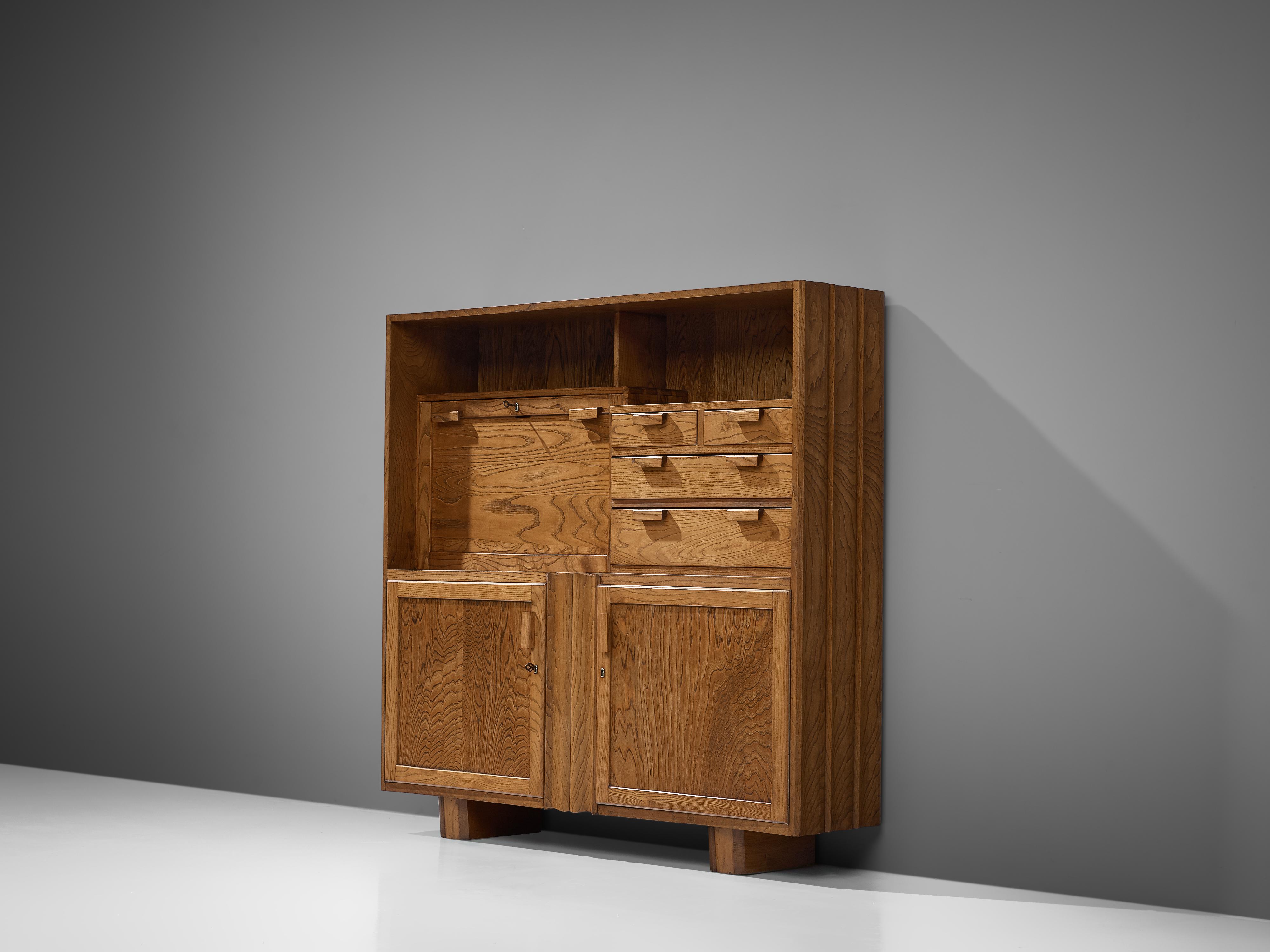 Cubic cabinet with writing table, ash, France, 1960s

A French cabinet completely executed in ash wood with dynamic grain and lovely wooden joints. The cabinet features several storage compartments: two doors on the bottom, two open shelves on top