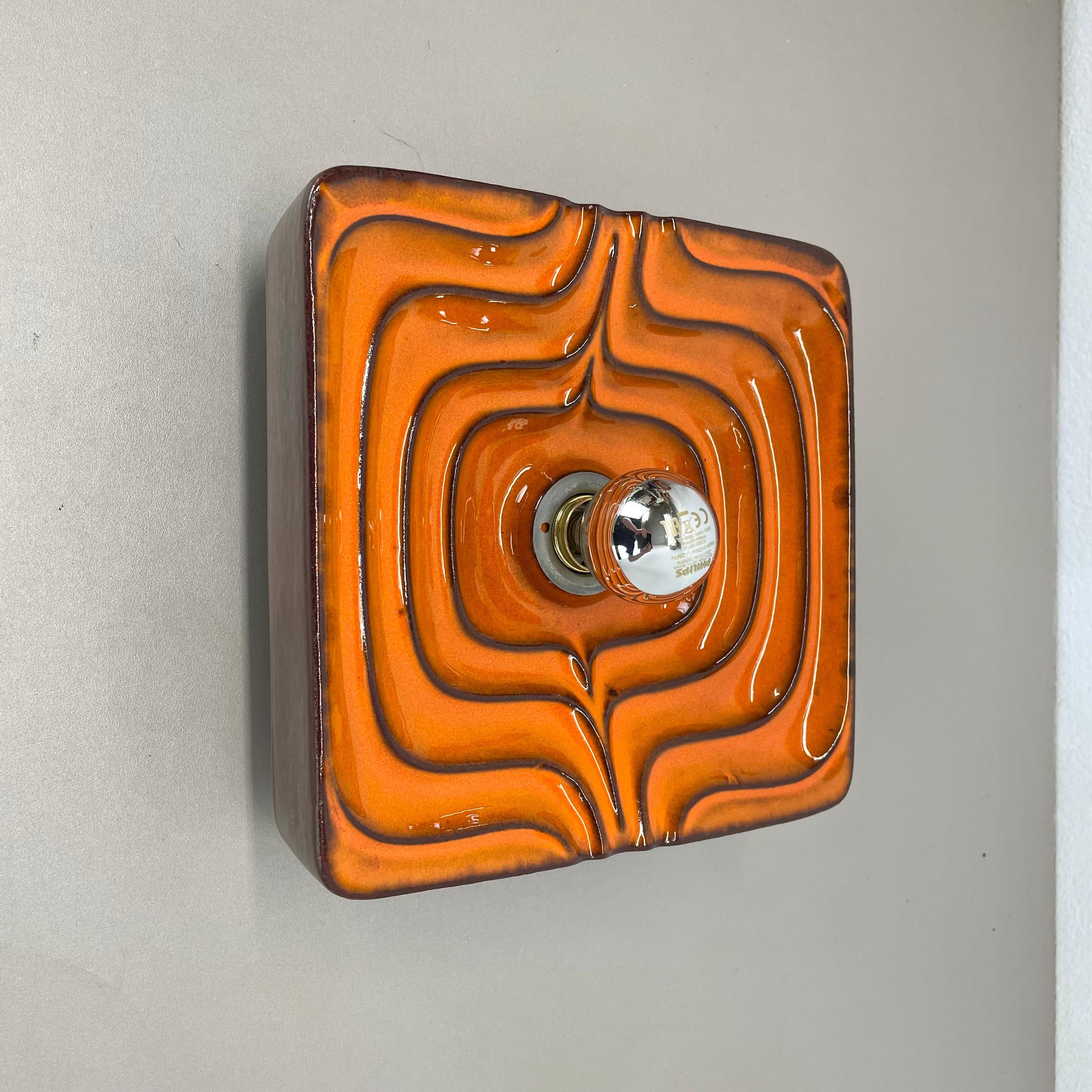 Article:

Wall light sconce


Origin:

Germany.


Producer:

PAN Keramik



Age:

1970s.



Description:

Original 1970s modernist German wall light made of ceramic in fat lava optic. This super rare light was produced in the 1970s in a POP ART
