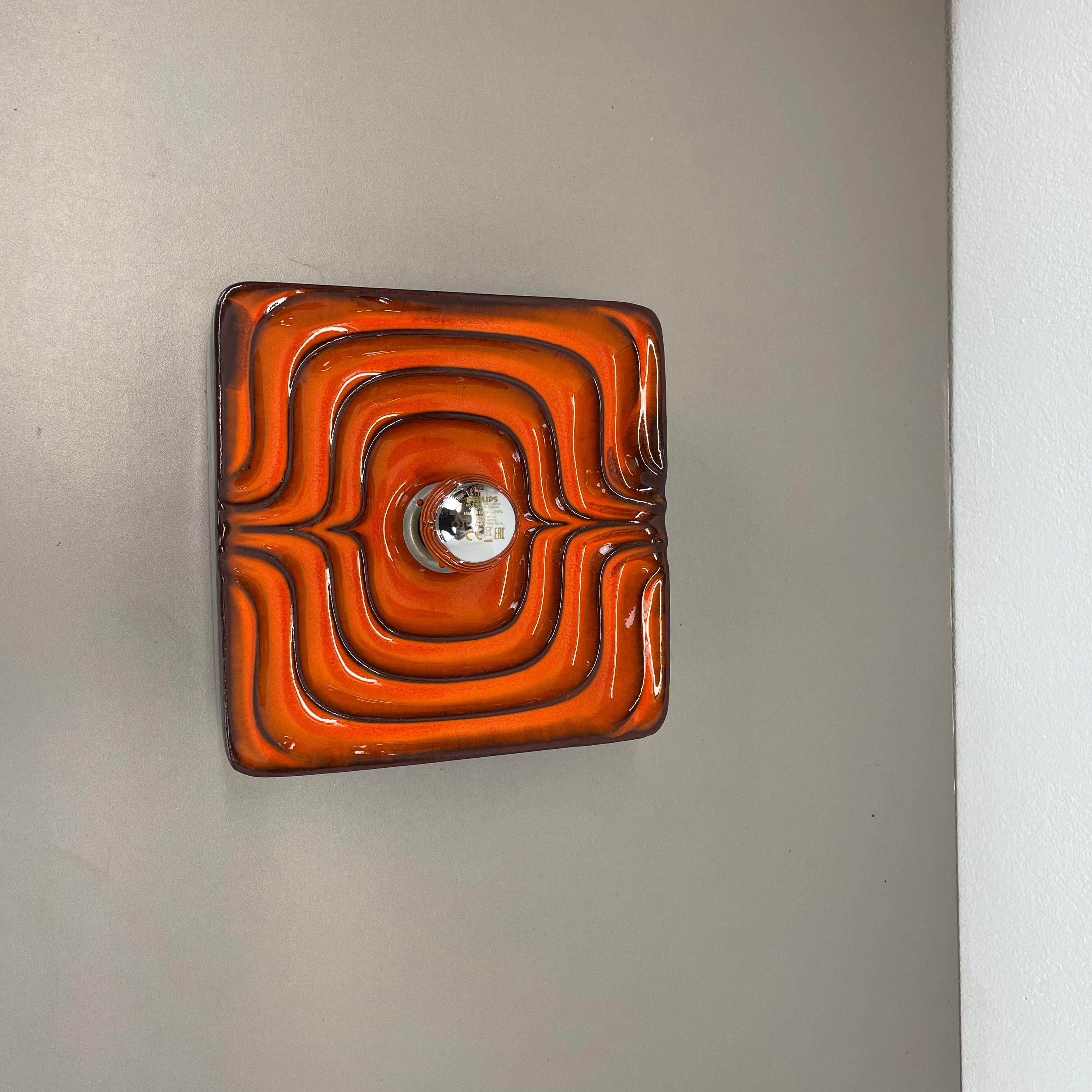 Article:

Wall light sconce


Origin:

Germany.


Producer:

PAN Keramik



Age:

1970s.



Description:

Original 1970s modernist German wall light made of ceramic in fat lava optic. This super rare light was produced in the 1970s in a POP ART