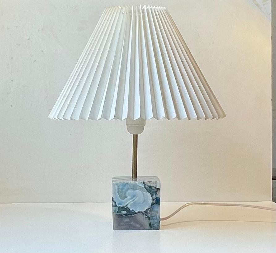 Unusual table lamp made from a cube in blue agate and mounted with a fluted acrylic danish shade. The cube is made from solid agate tiles (1 cm) thick.. Unknown Scandinavian designer/maker circa 1990-2000. Measurements: H: 43 cm, Diameter: 27 cm.