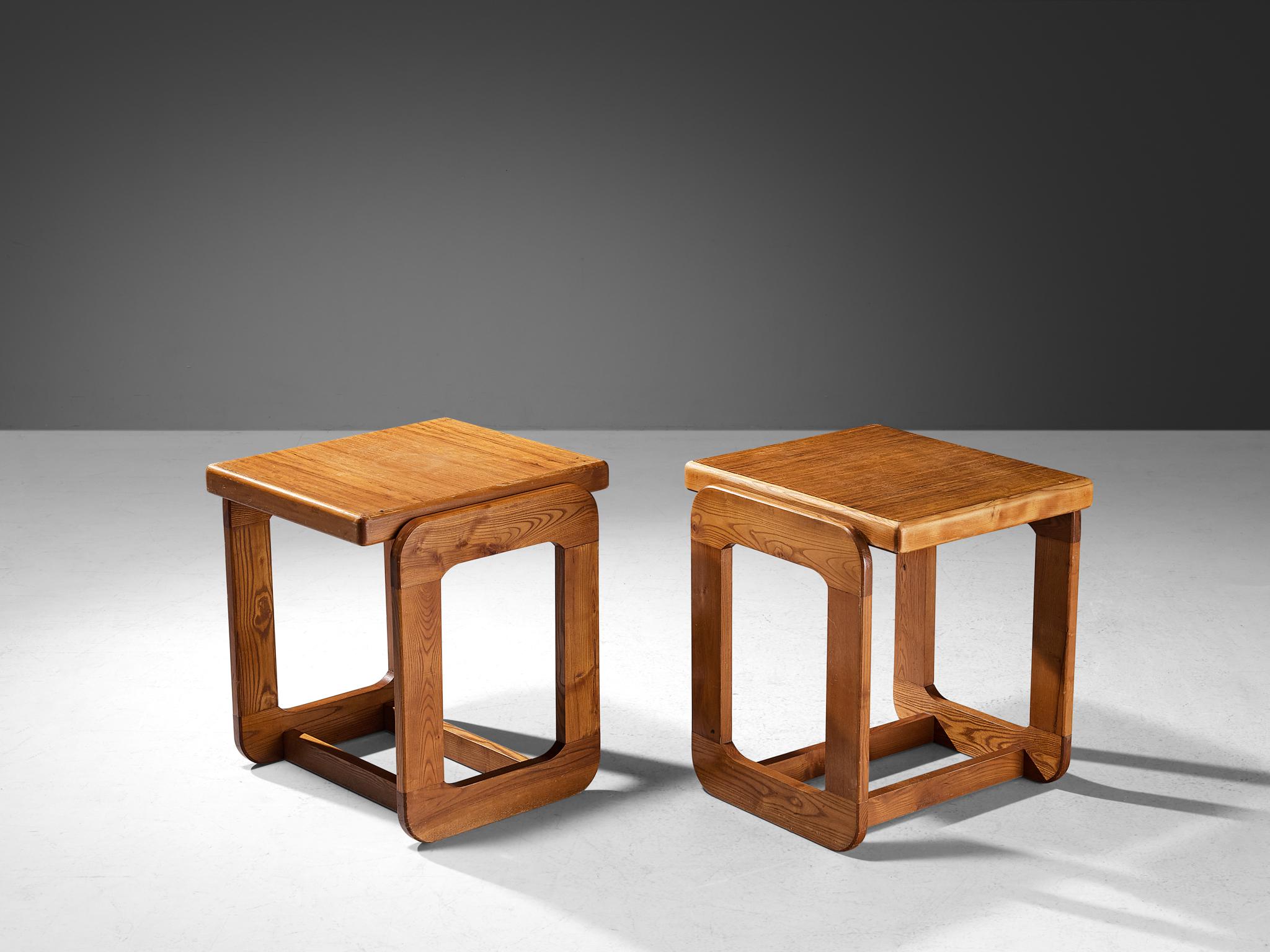 Side tables, ash, Europe, 1970s.

A set of side tables with geometric shapes composed entirely of cubic forms. The frames take on a rectangular shape with open cuts, creating an open and transparent aesthetic within the sturdy structure of the