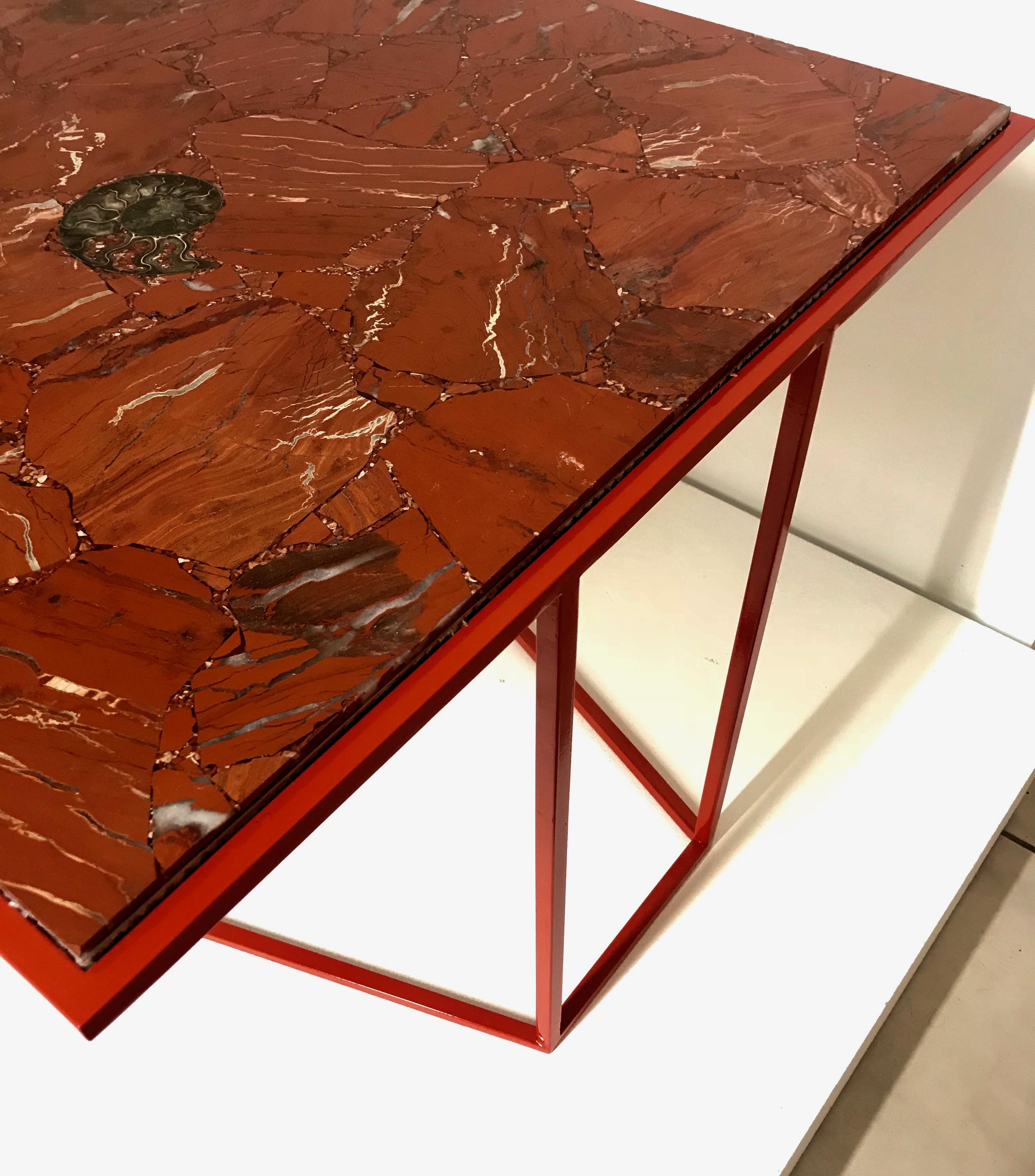 The red jasper cubic cocktail table belongs to our 'Cubic' collection. It is a beautiful and sculptural piece comprising a square shaped red jasper gemstone slab which sits upon a red hand welded sculptural base. 

It presents a visually