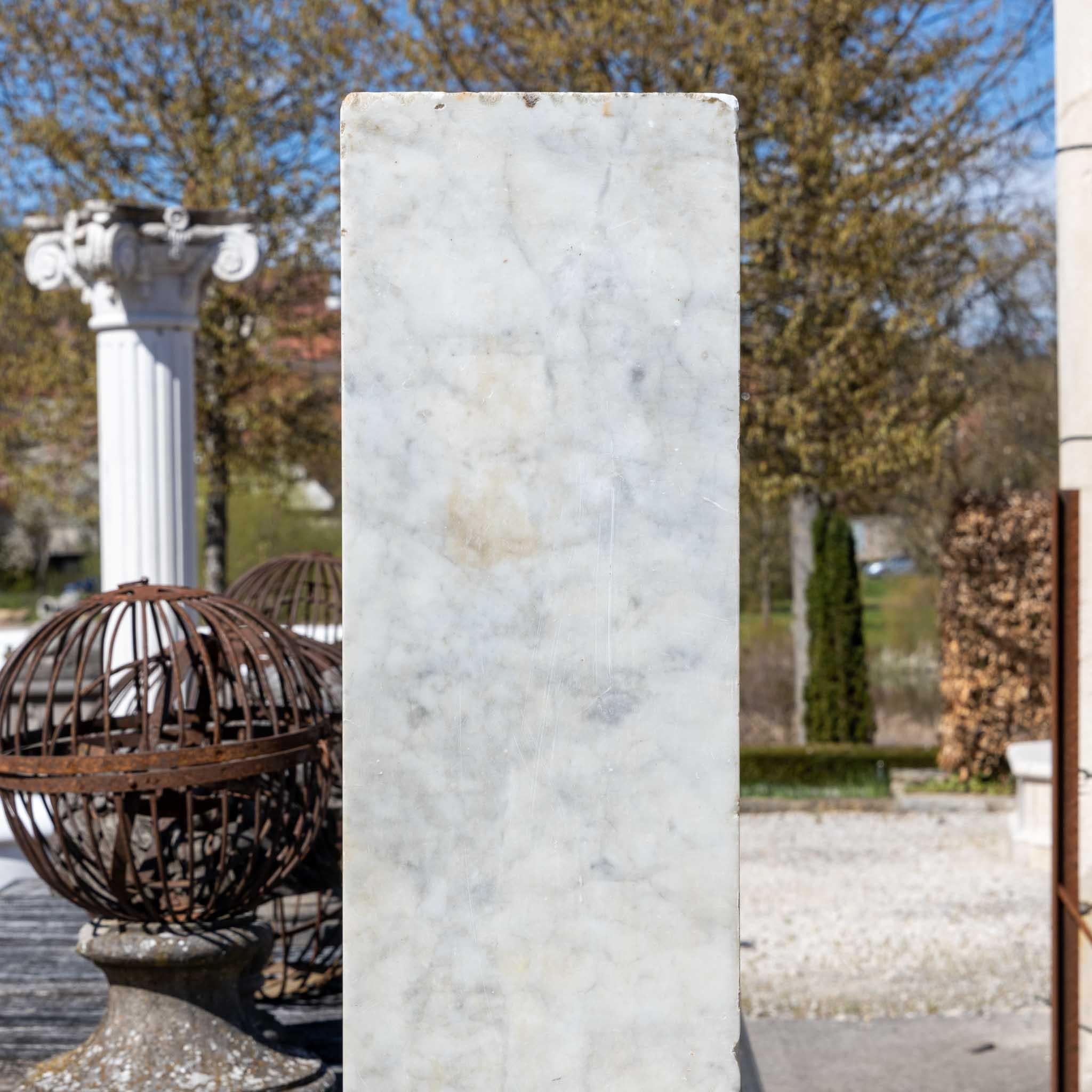 Two cubic stelae made of Carrara marble from court property.