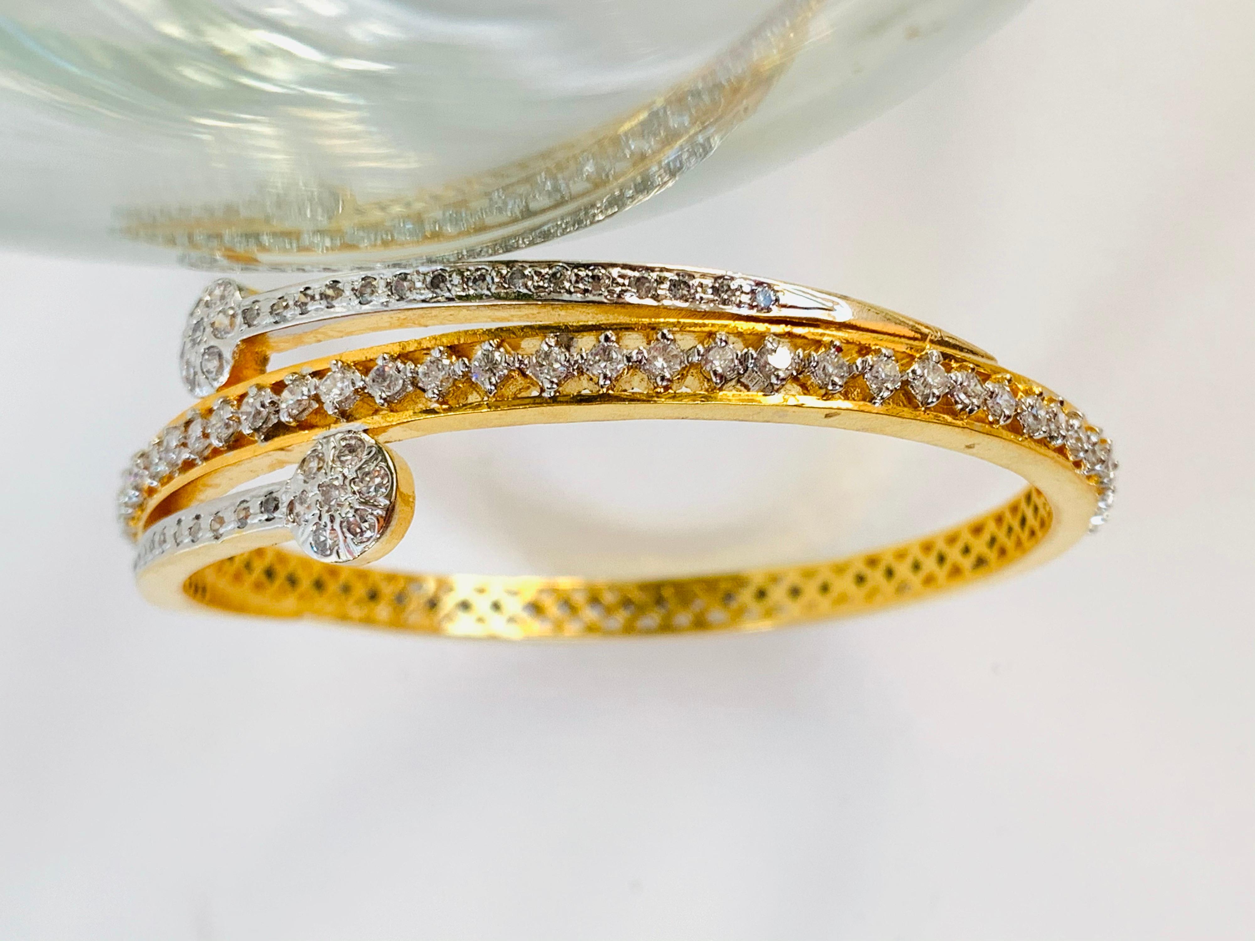 Hand made slip on bangle embellished with sparkling cubic zircon. Inner diameter 65.00 mm (2.56 in), inner circumference 204.2 mm (8.04 in).  Single Bangle.

FOLLOW MEGHNA JEWELS storefront to view the latest collection & exclusive pieces. Meghna