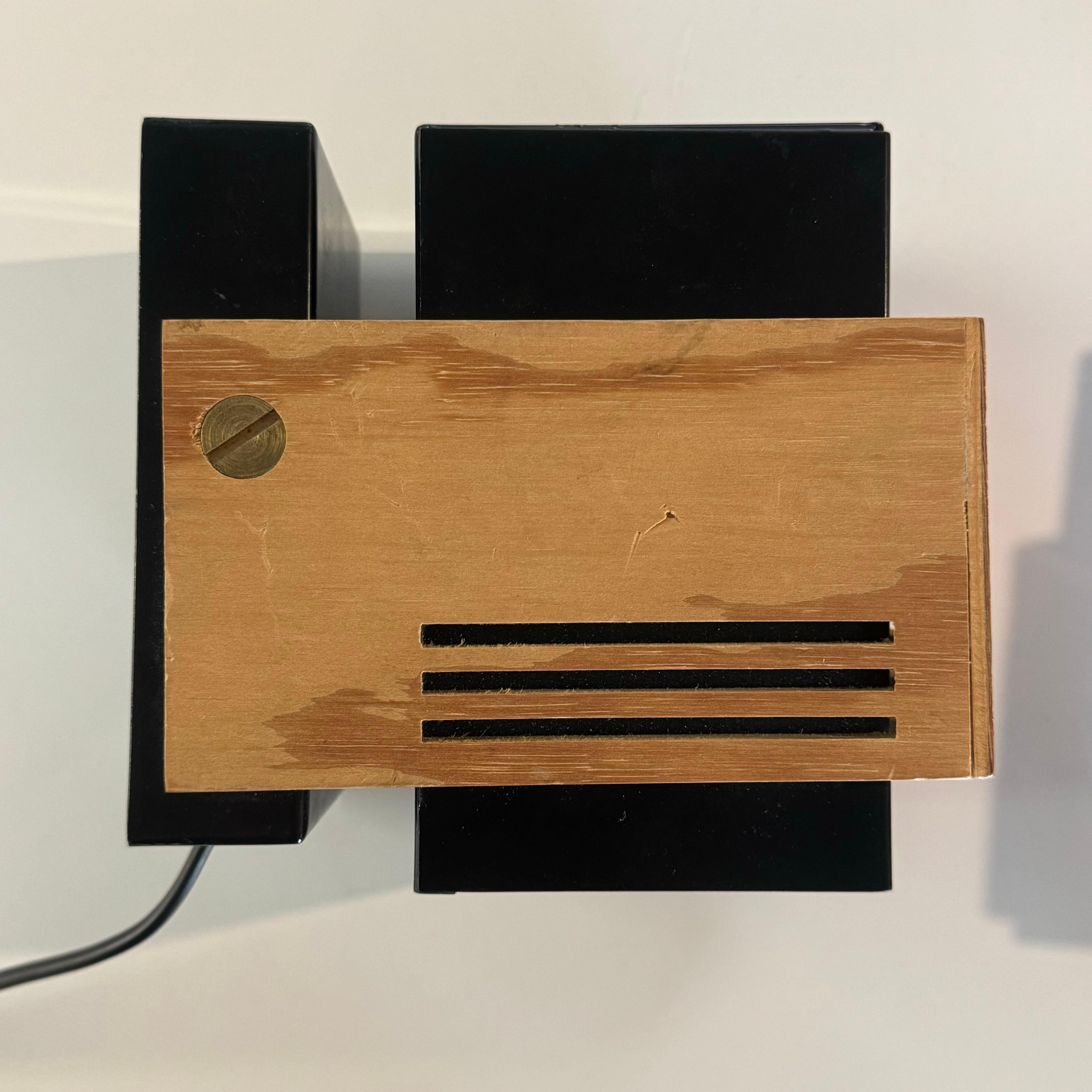 A pair of 2 very rare wall lights manufactured by Cebo Industri in Denmark, model nr. 9001 in black lacquered steel and plywood. 

Constructivist/cubist style in modern Scandinavian materials. 

Designed by Claus Bolby during the 1970s along with a 