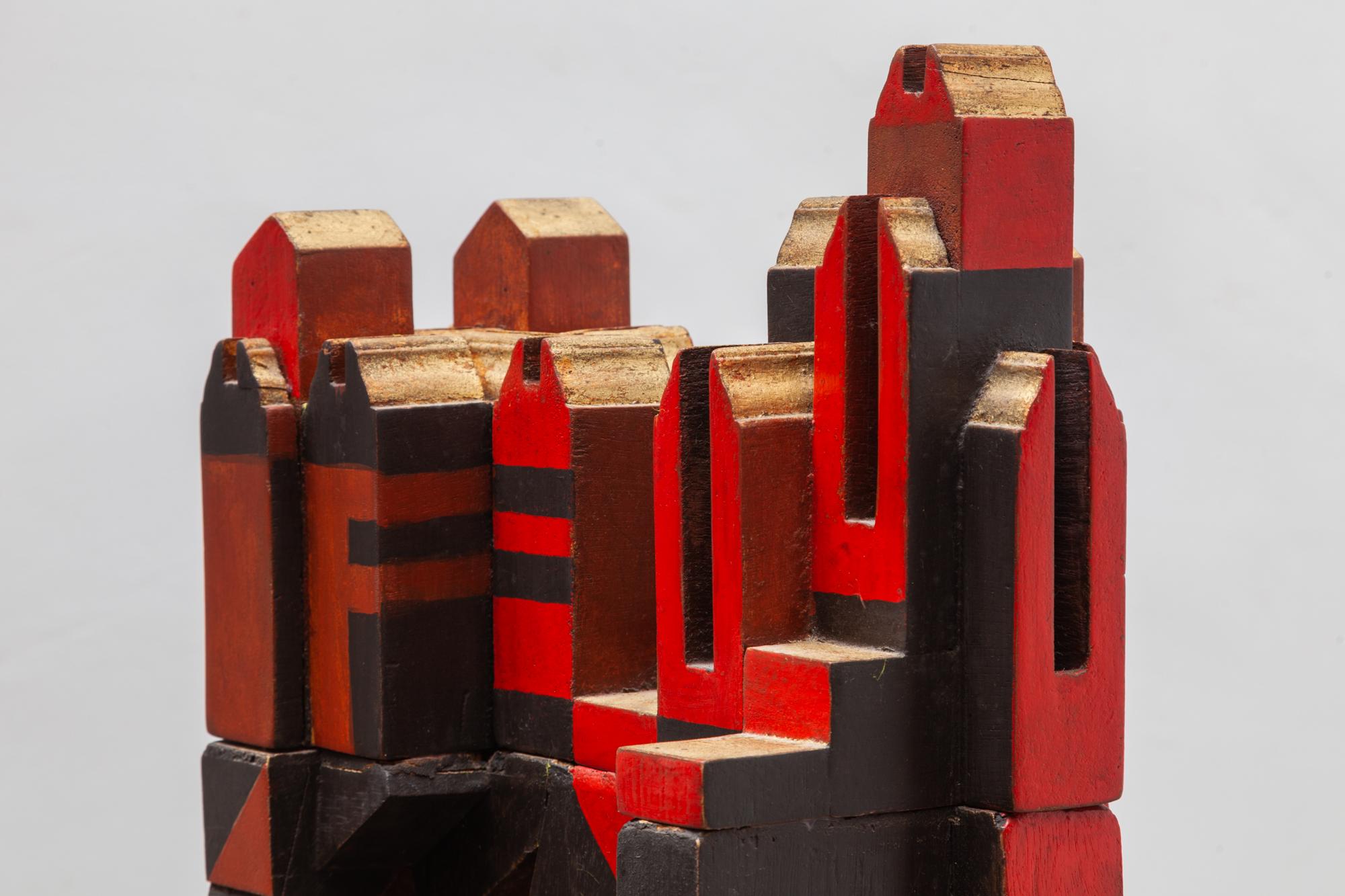 Large wooden sculpture by the Artist Jhan Paulussen, Belgium, 1960s. Signed JH.
Cubist design in solid wood, reds, and browns which appears to be cityscape resting on a mountaintop.
The top can be lifted off of the base into two parts.

Dimension: