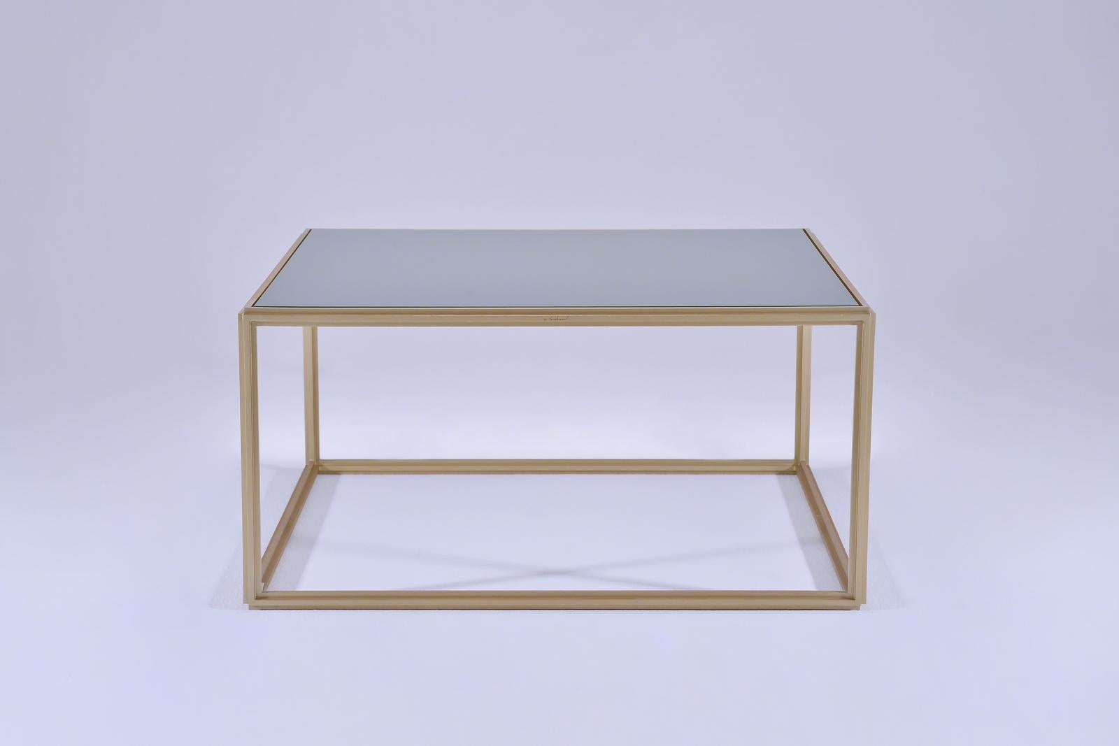 We love this play of contrasts in this version of our PT6 Brass Low Table with an emerald green top glass top. 

Inspired by the modernists we created this cubist table in extruded brushed brass and hand-welded profiles. We created this one for a