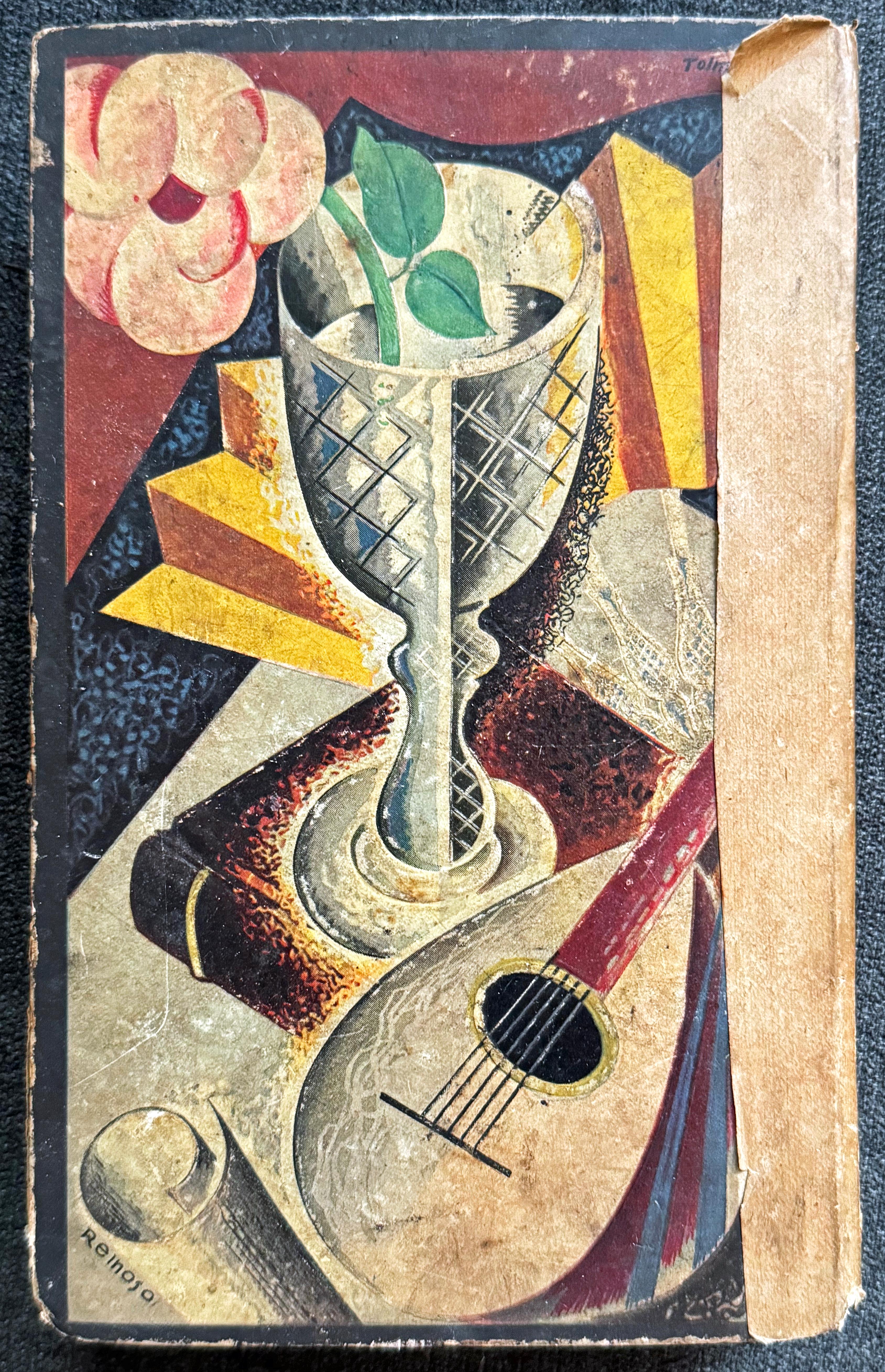 A gorgeous example of Cubist-Art Deco design, this 19th century book was given a new cover and end papers designed by Reinoso for the Printemps department store in the 1920s.  The cover design presents a classic Cubist still life, with a cut glass