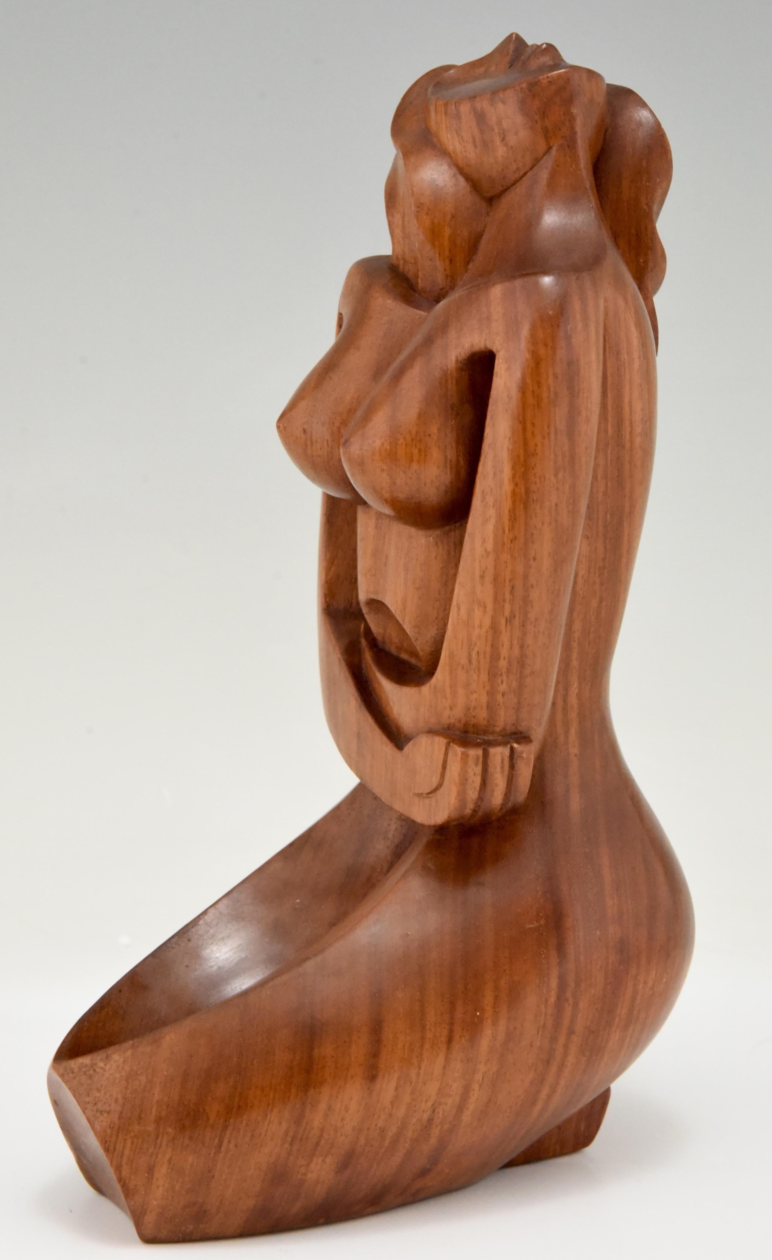 Mid-Century Modern, Cubist style hand carved mahogany wooden sculpture of a seated nude, France, 1960.