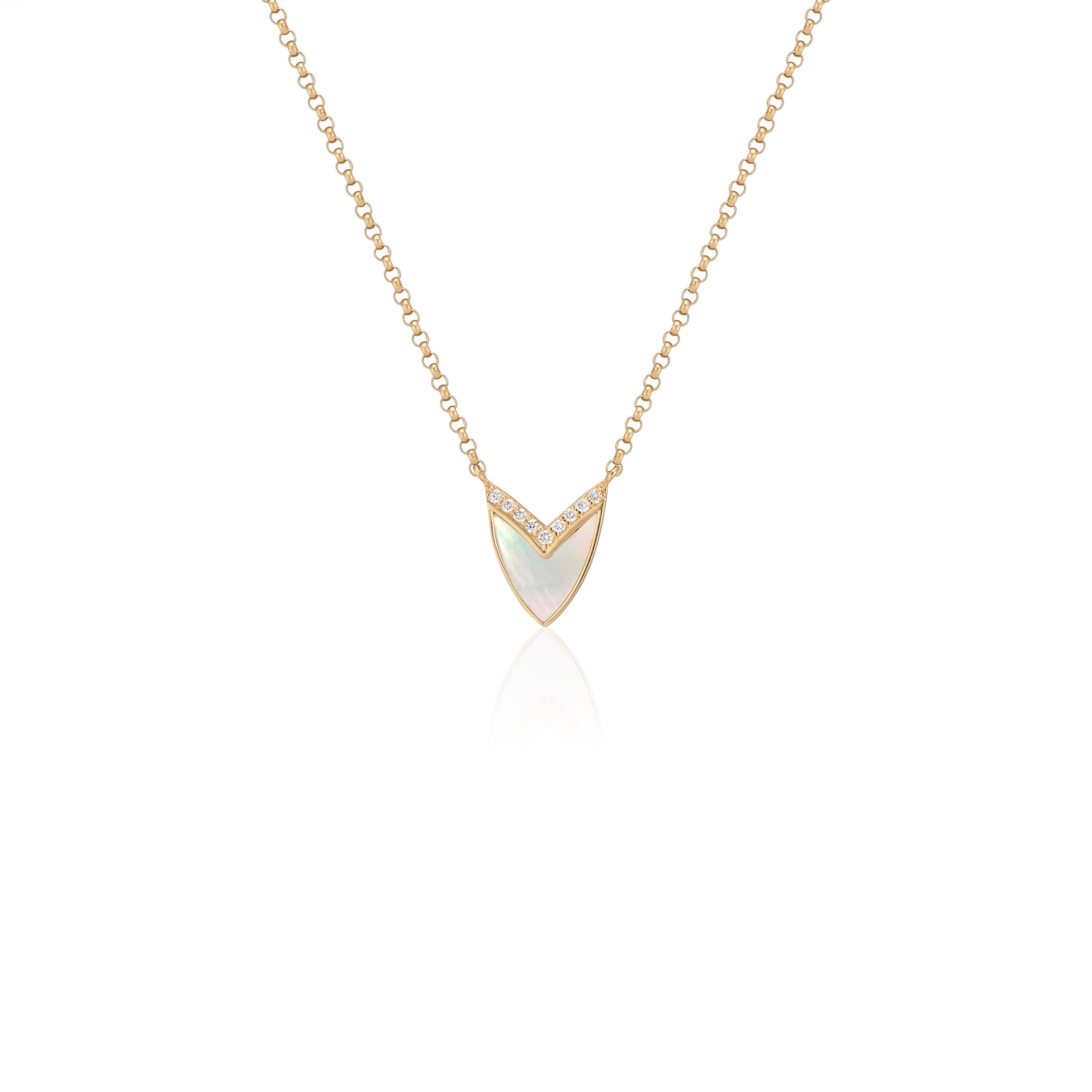 Subtly elegant, Ri Noor’sCubist Heart Necklace with Mother of Pearl, Ruby, and Diamonds adds a refined sophistication to any outfit. The pendant takes inspiration from the shape of a heart, abstracting it to a geometric form complete with an angled