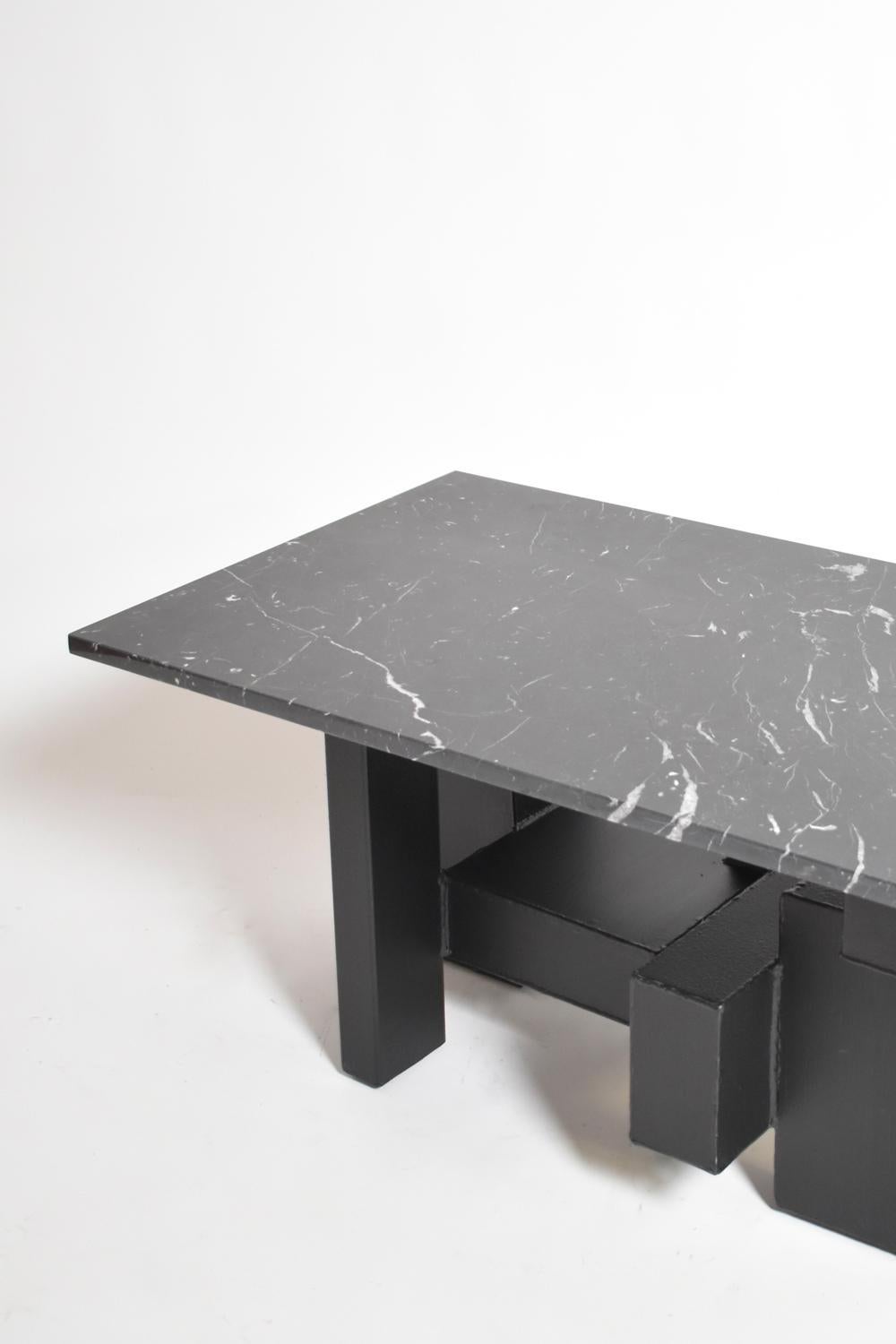 Cubist coffee table or side table with an iron base made of cubes supporting a black marble table top. France, 1980s