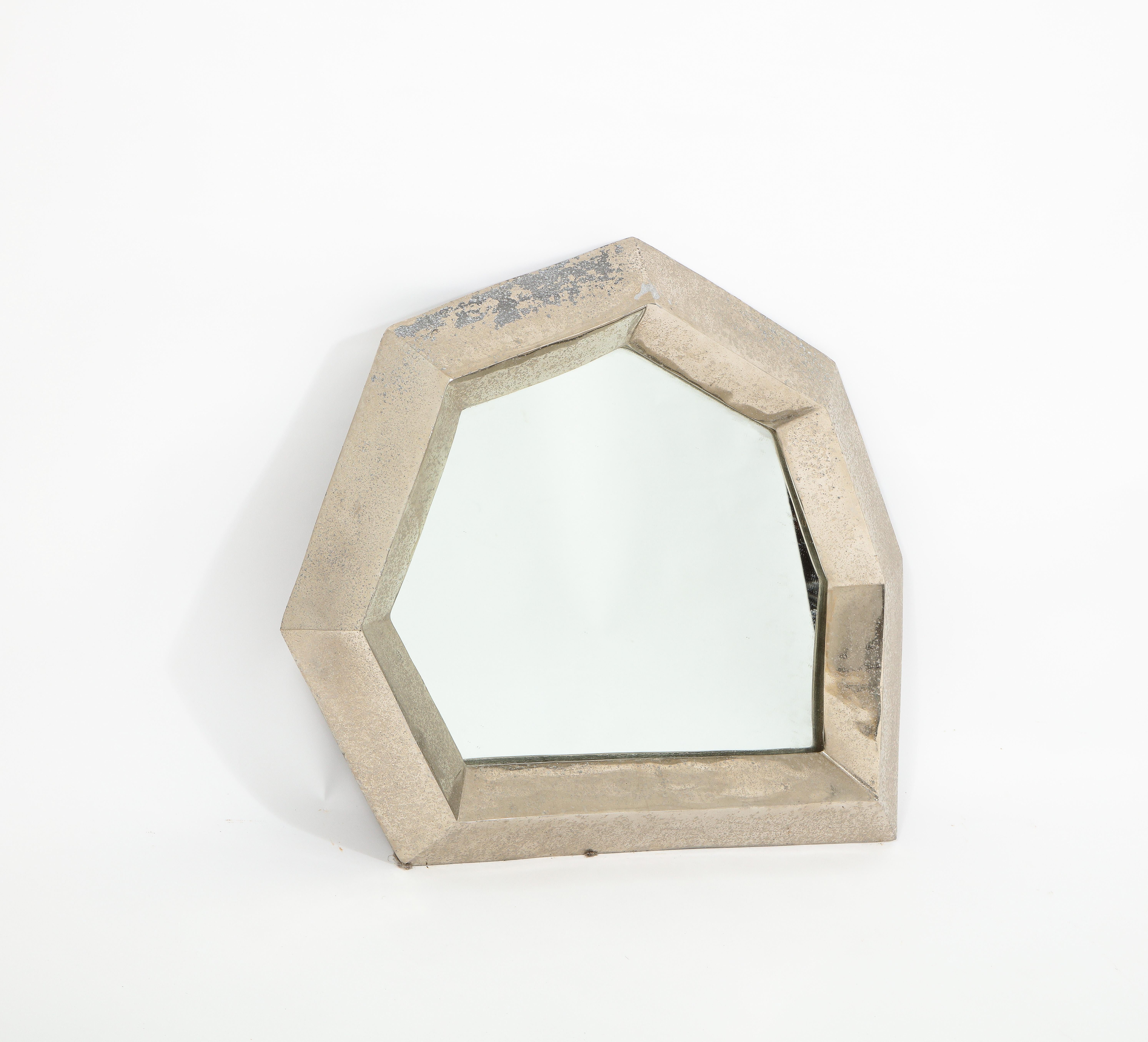 A cubist mirror in nickel-plated bronze with a wonderful patina.