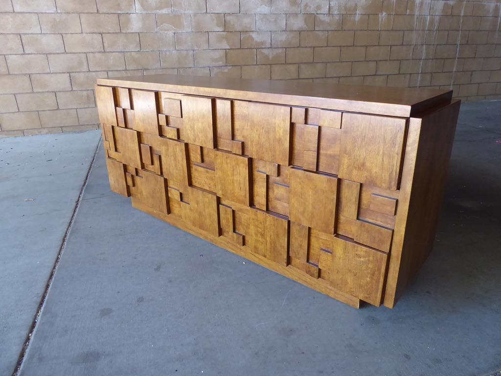 A nine-drawer walnut chest with Cubist inspired drawer fronts made by Lane Furniture Company in the 1960s.
The chest is in very good original condition with minor vintage wear. Presents beautifully, ready for placement.
 