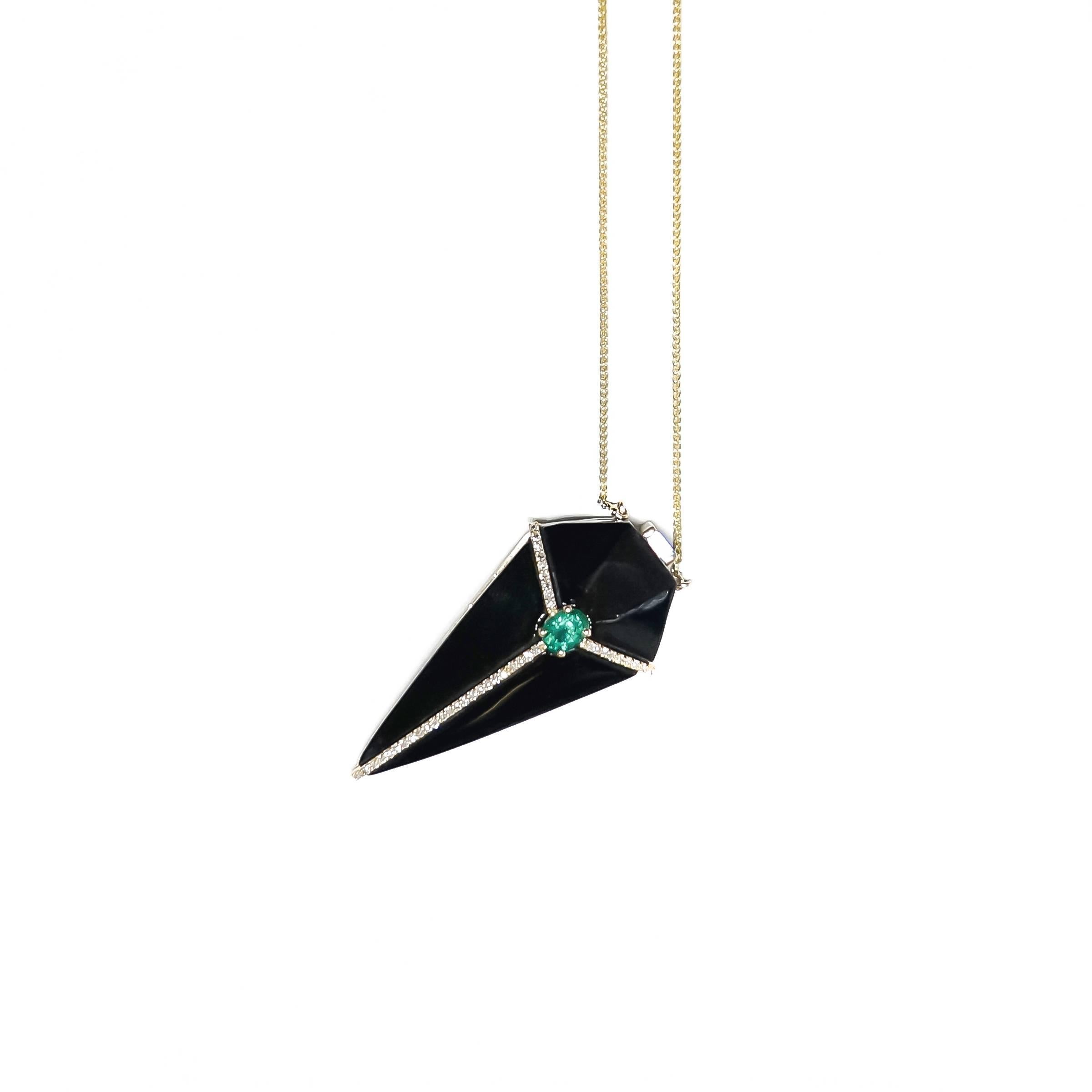 A captivating design, Ri Noor's Cubist Onyx Pendant Necklace with Diamonds and Emeralds boldly features glossy black geometric forms created of carved onyx with 14k yellow gold accents. The stunning necklace feature unenhanced emeralds accented by