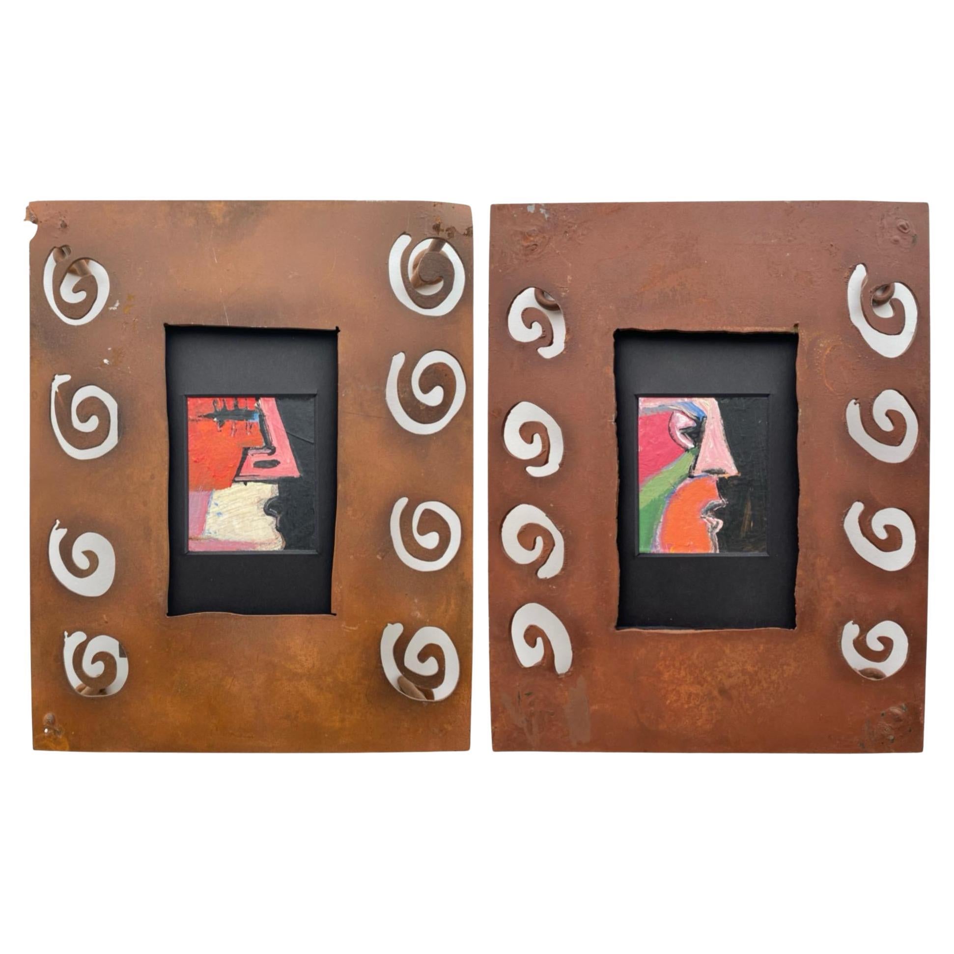 Pair of Modernist original paintings with a Cubism feel. Steel frames project from wall surfaces in a sculptural form.

Frames have been selected to both highlight and contrast from the paintings. Mexican rusty steel, handmade frames wonderfully