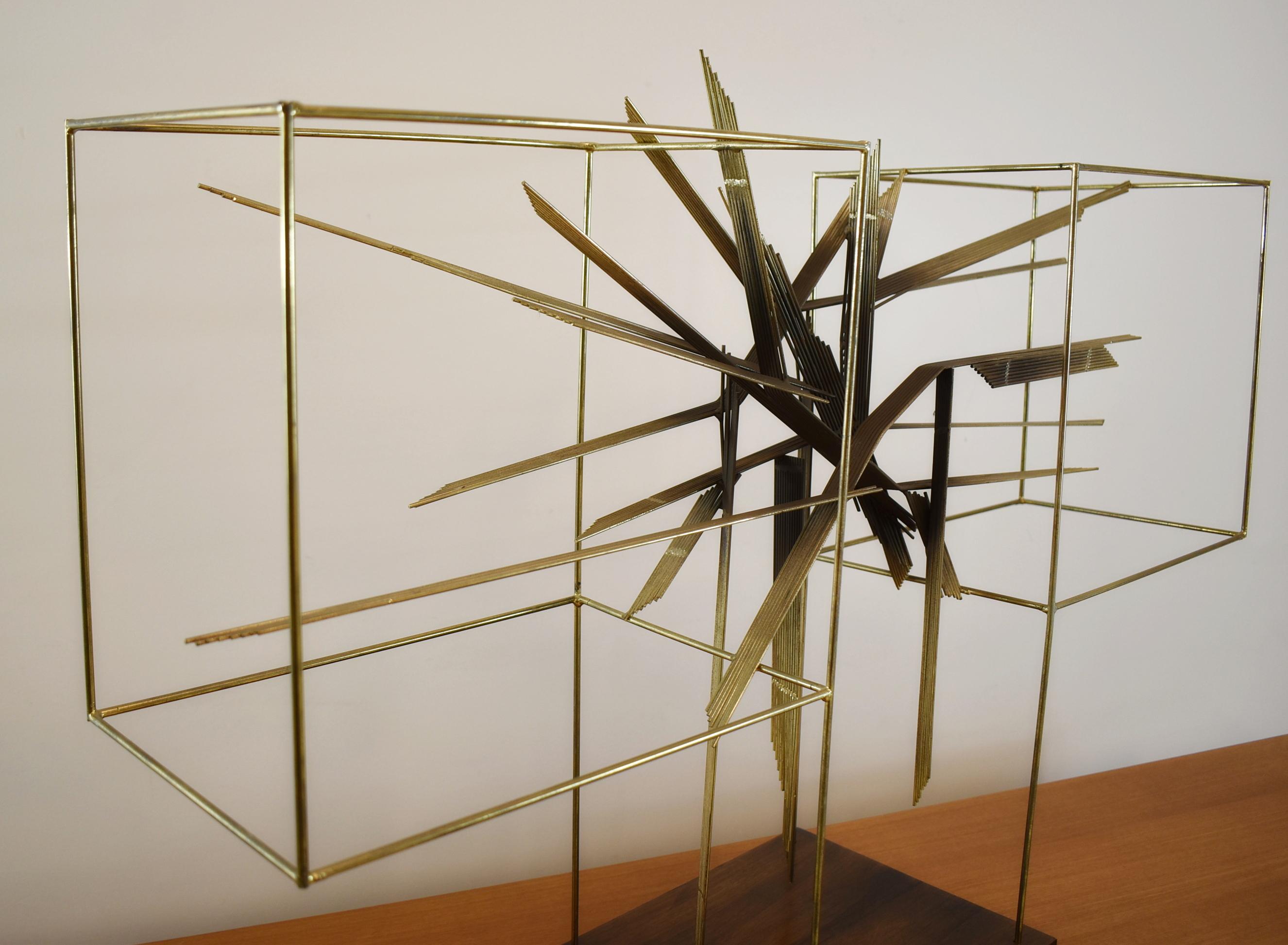 Curtis Jere sculpture, two wire square with an inner area of stacked rods in varying positions, sits on a wood base, signed, circa 1978.

Dimensions: 37
