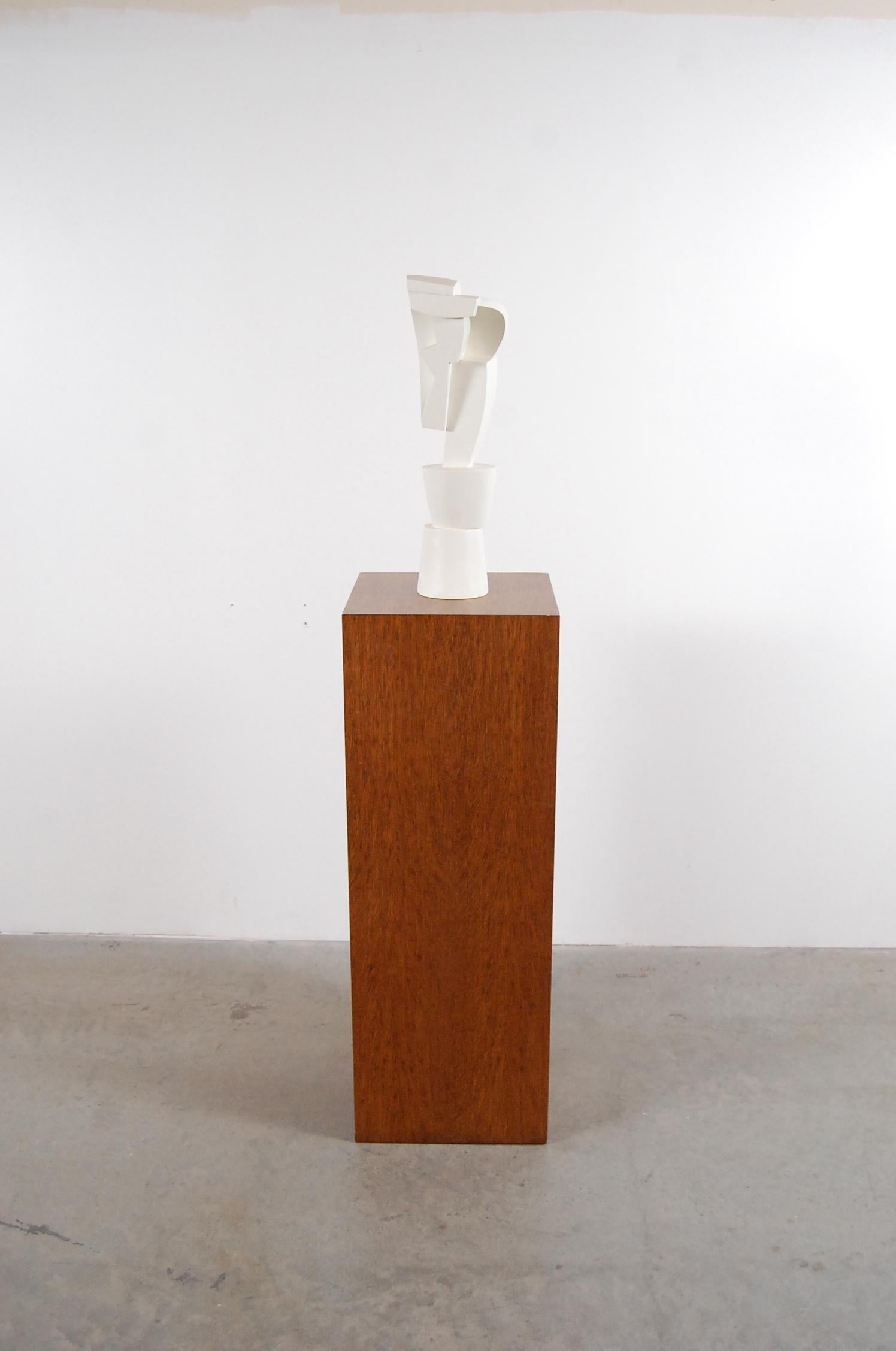 Cubist sculpture on oak pedestal by Peter Ambrose. This piece (untitled) was created by Mr. Ambrose in 2000 exclusively for designer Judy Niedermaier as a prototype, and was intended to go into limited production for Niedermaier. Production was