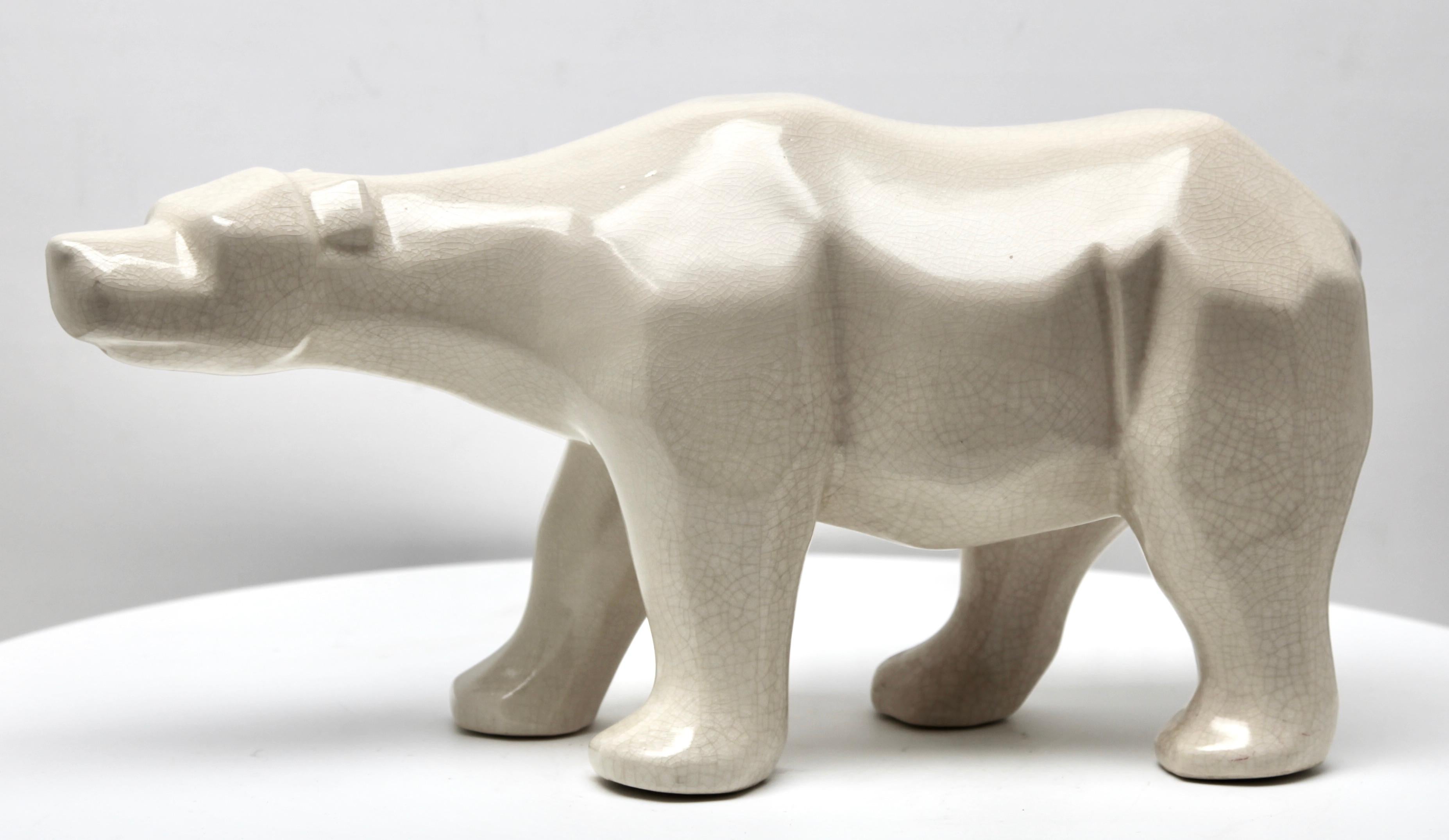 Art Deco Cubist style figurine in white glazed Ceramic. Finely detailed and modelled figurine of a Polar Bear 
Stamp L&V Ceram
France 1930s

Condition: Very good.
Dimensions Height: 8.5 inch. (21.59 cm)
Width: 16 inch. (40.64 cm)
Depth: 5.25 inch.