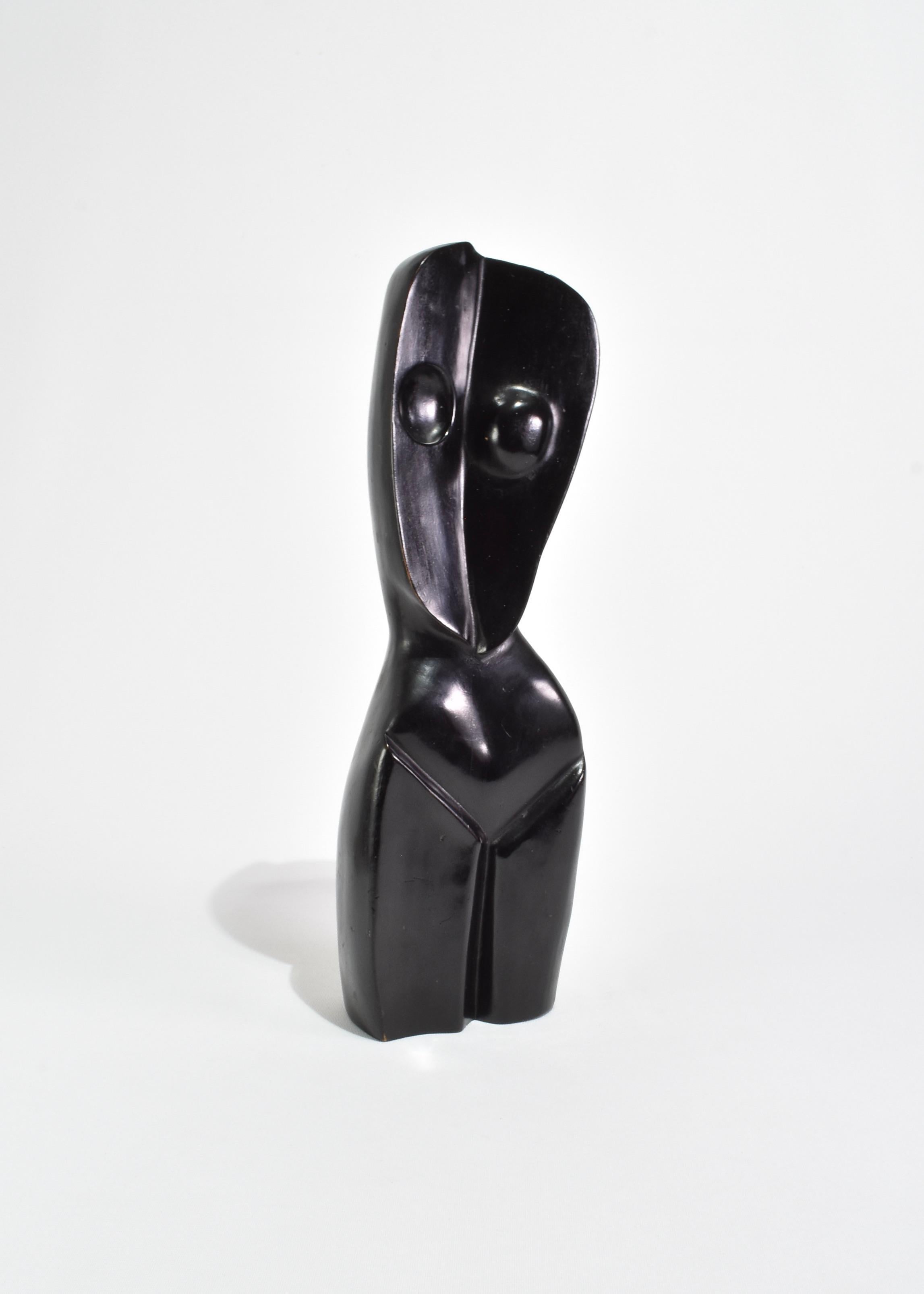 Cubist style carved torso sculpture in ebonized wood. Ca. 1960s.