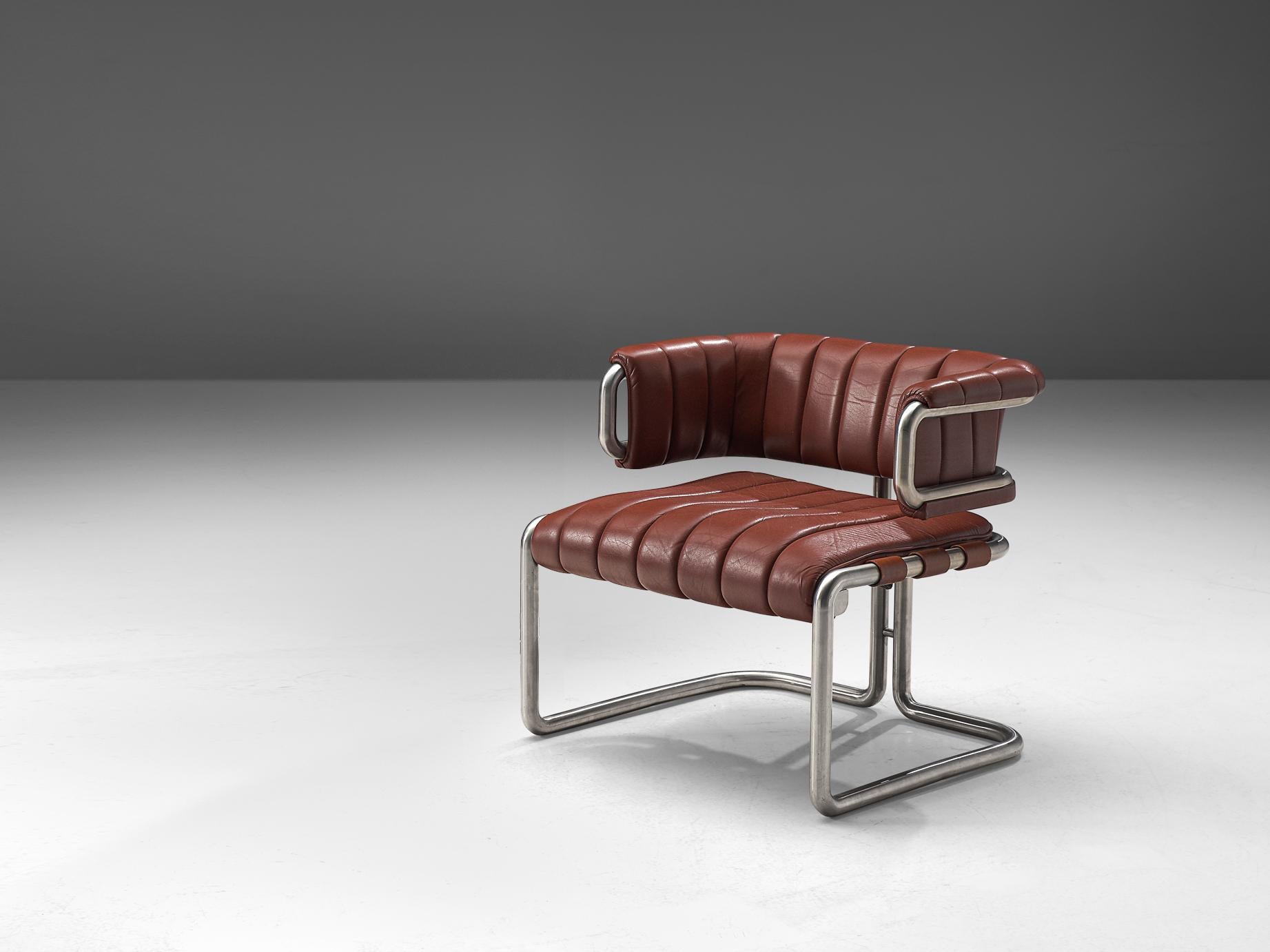 Lounge chair, leather and metal, Germany, 1960s

Dark red leather chair with metal tubular steel. This chair is characterized by clear, straight lines that are noticeable in the leather as well. The frame of the chair is made from high quality