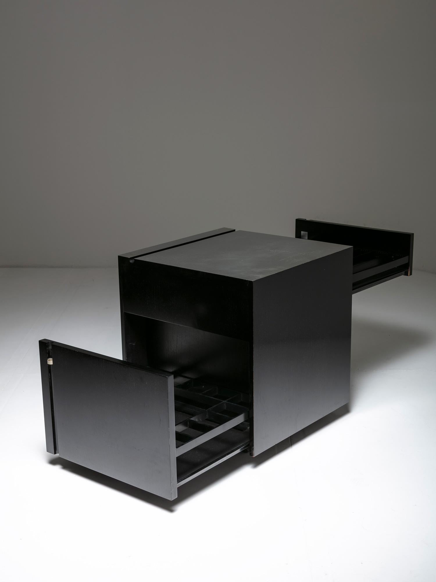 Cubo bar by Studio O.P.I. for Cini & Nils.
Sleek capable piece with two drawers ready to host up to 25 bottles and 50 glasses.
