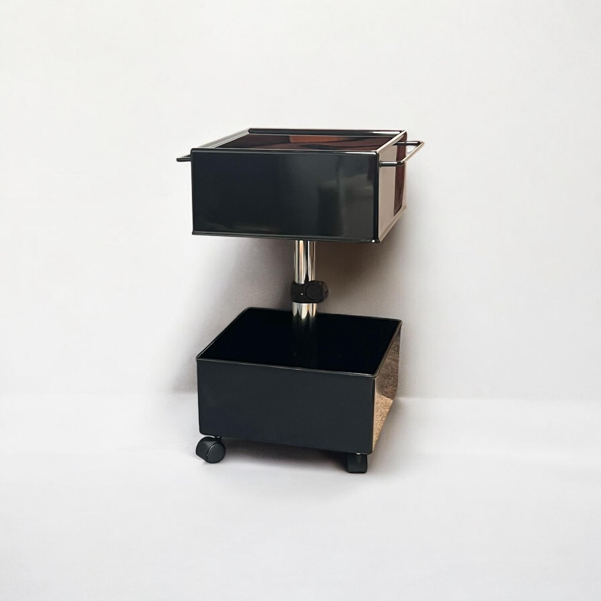 Discover the 1970s CUBO Mobile Bar, a functional example of Space Age furniture design by Studio Magis and manufactured by Segato for Magis Italia. 

Its adjustable height, enabled by a telescopic metal tube, makes it versatile as a trolley, side