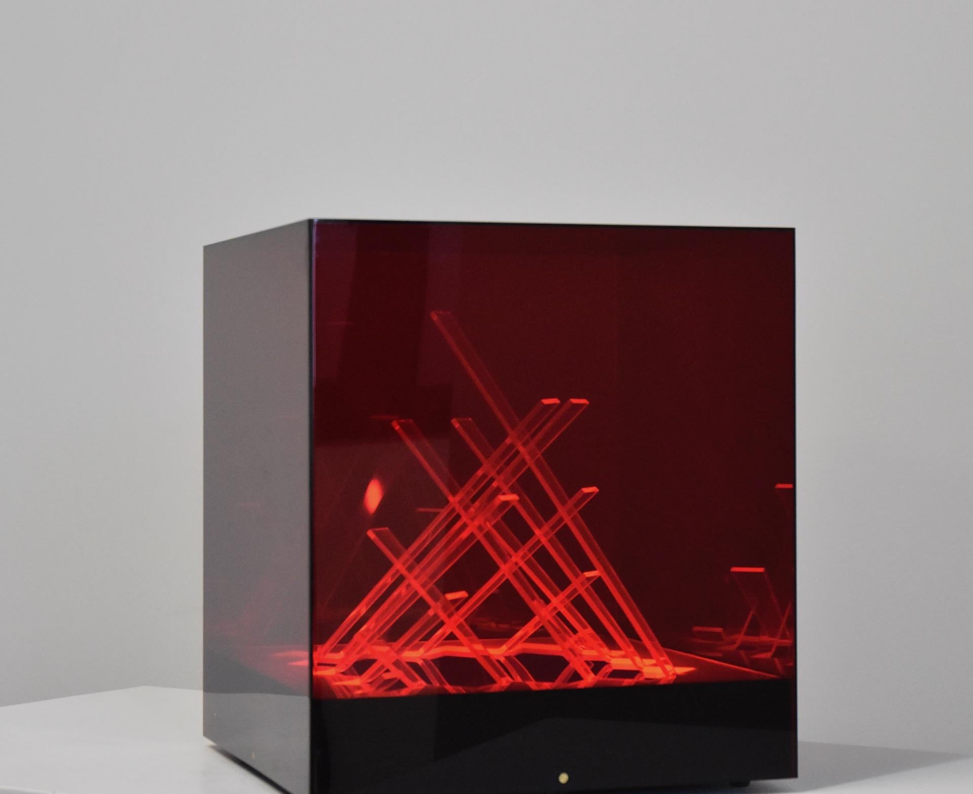 Rare Iluminated sculpture named Cubo di Teo designed by James Rivière in 1970s and edited by Centro Ricerche di Arte Industria Lissone, Italy. Colored acrylic pieces and base with internal light.