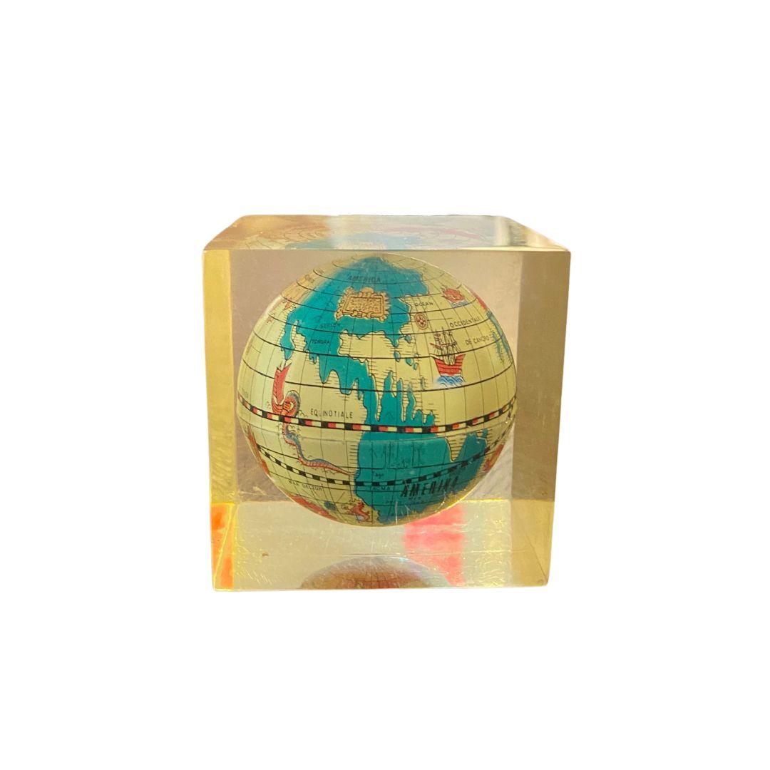 A vintage world globe encased in lucite, makes for a unique and fun desk accessory.