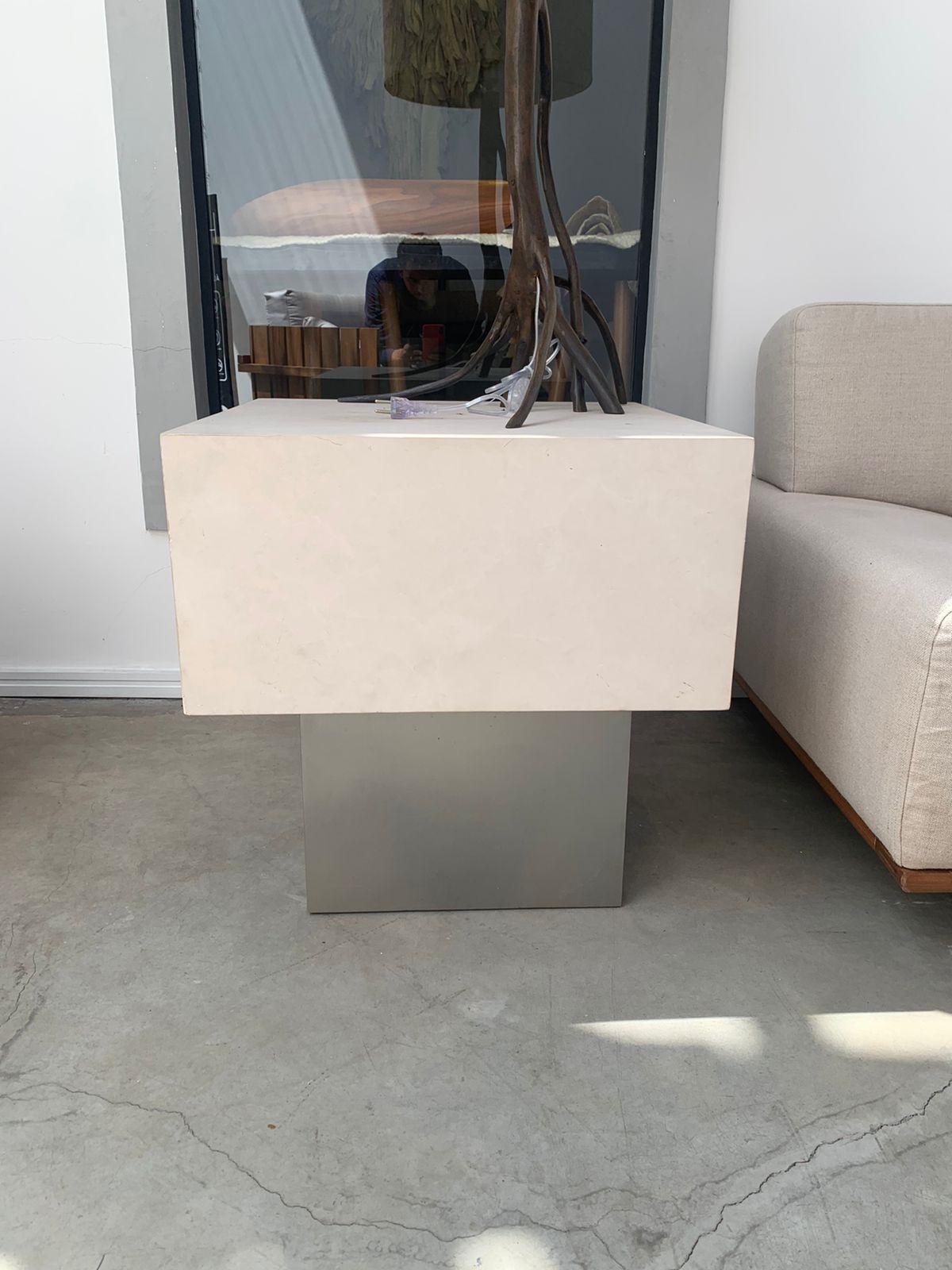 The Cubo side table, designed by Arthur Casas in the beginning of the 90's is a solid and elegant creation with a view on minimalistic design. 

The structure is made of painted carbon steel and the beautiful top can be made in navona travertine,