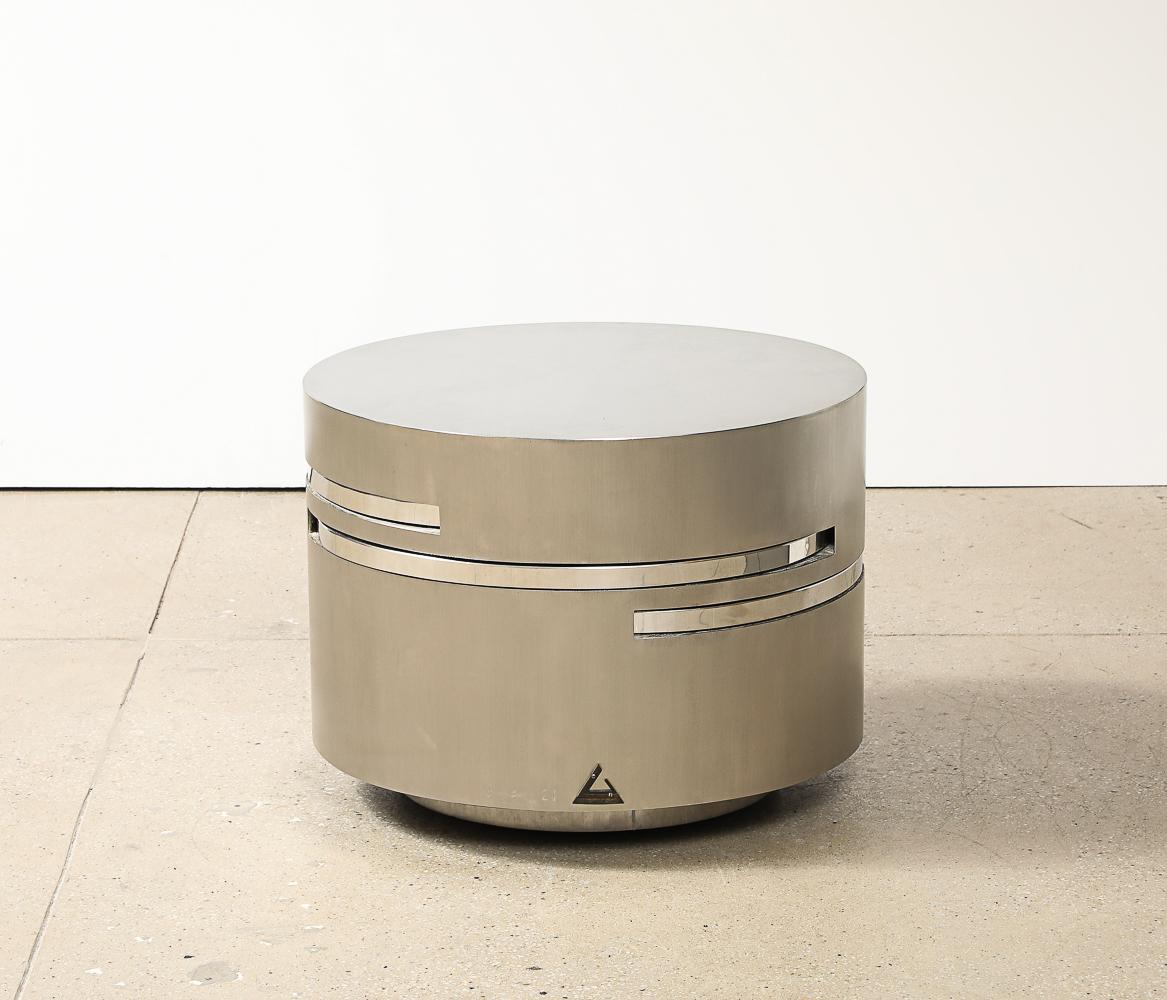 Brushed & polished steel, wood, brass. Circular coffee table with extendable leaves. From the 1970's iconic Plurimi series designed in 1976. Impressed with artist's signature and with applied artist's brass logo. Measures h. 18