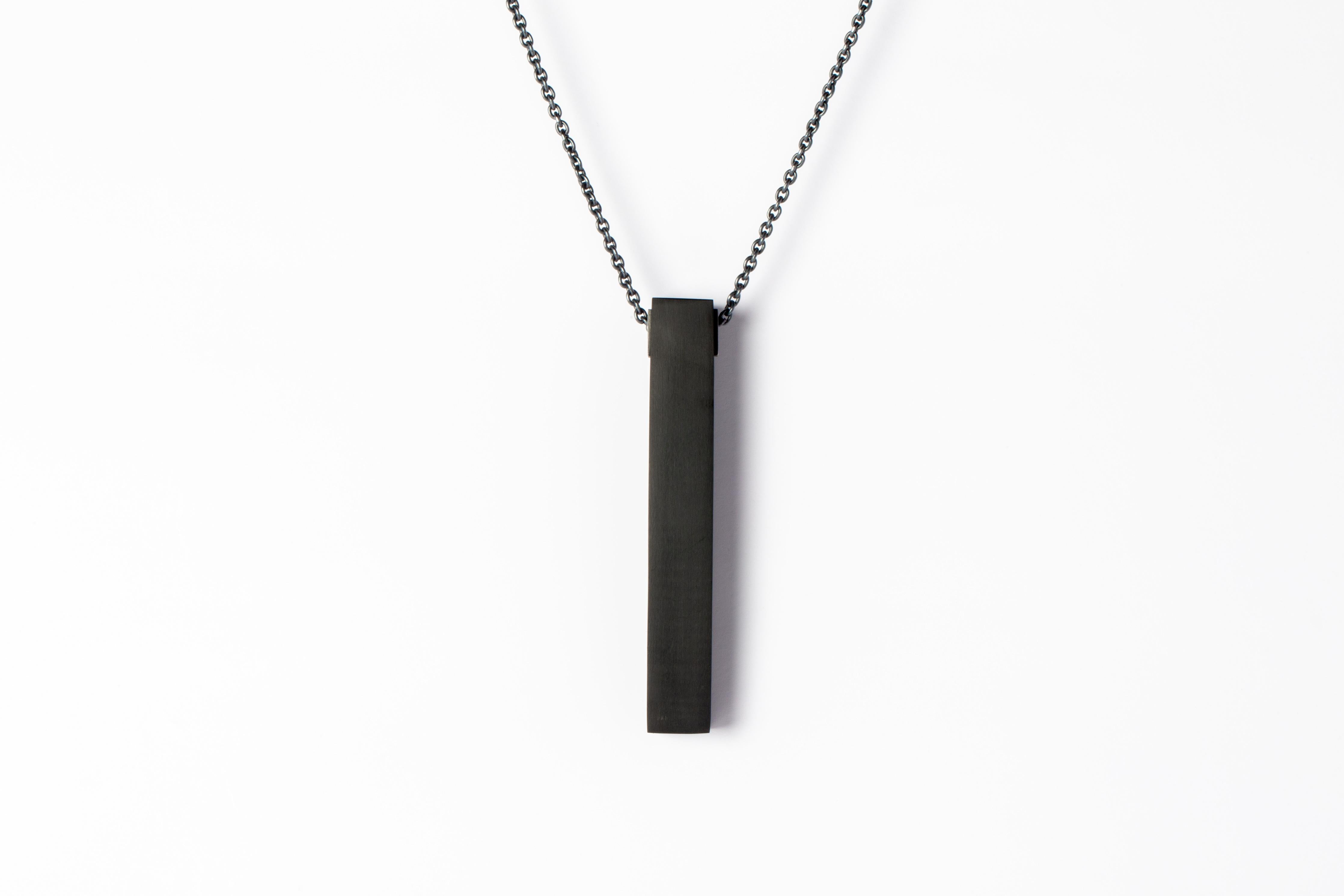 Pendant necklace in the shape of cuboid in JET, it comes on a 74cm sterling silver chain. This oxydized finish may fade over time, which can be considered an enhancement. Please note that Black Sterling tends to appear darker in photograph than in
