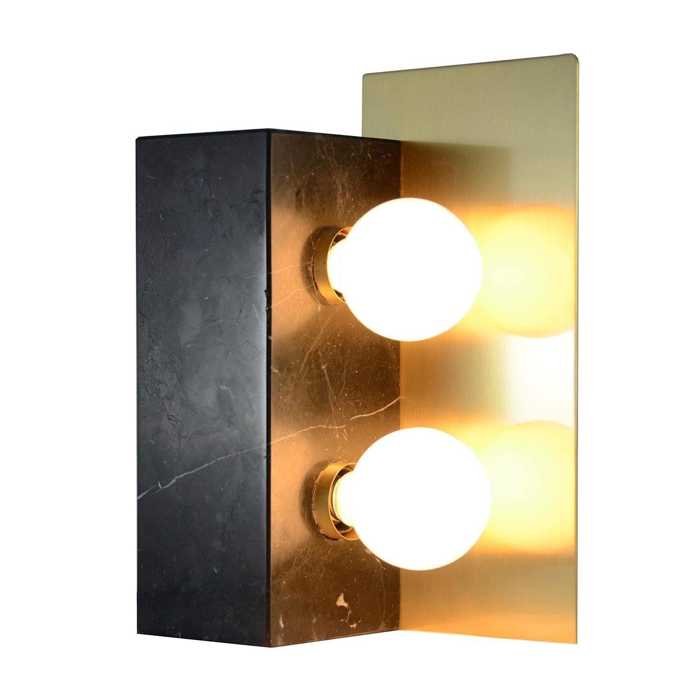Monolithic table lamp in satin black Marquina marble and satin brass with a vintage look.