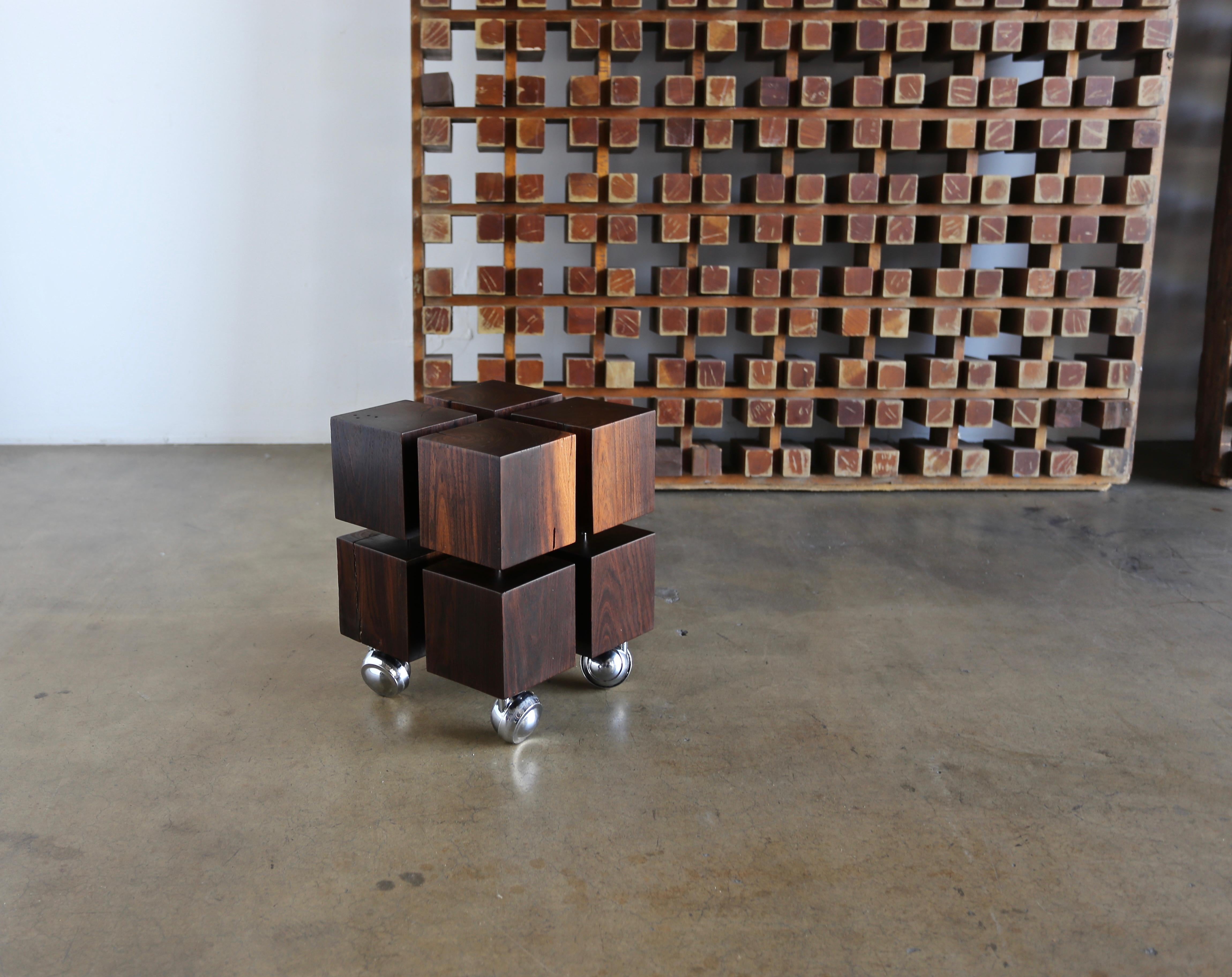 Solid Cueramo wood occasional table on castors, circa 1970.

 