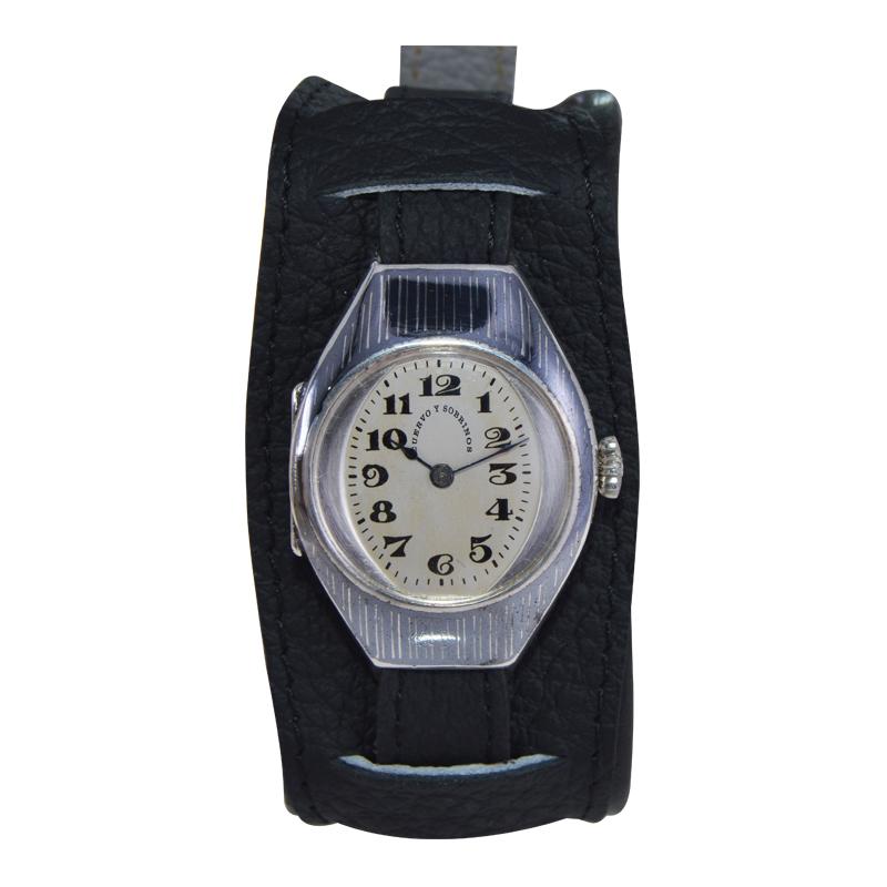 FACTORY / HOUSE: Cuervo Y Sobrinos 
STYLE / REFERENCE: Tonneau Shaped / Military Style 
METAL / MATERIAL: Sterling Silver and Niello Inlay
CIRCA / YEAR: 1915
DIMENSIONS / SIZE: Length 39mm x Width 26mm
MOVEMENT / CALIBER: Manual Winding / 15 Jewels