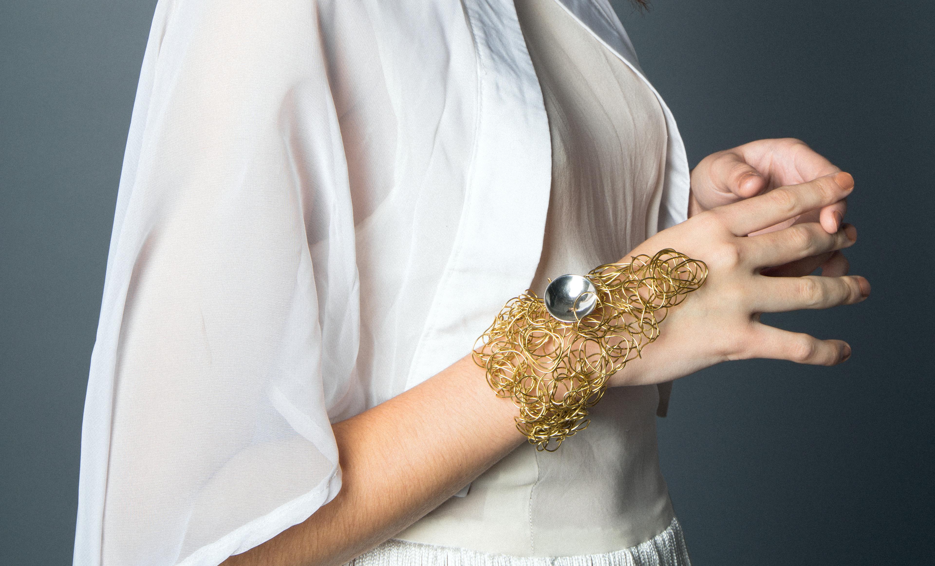 A very sexy cuff for daring women. You will get the attention you are craving when wearing this daring handcrafted piece. This cuff definitely finishes off and personalizes any outfit you choose to wear it with. The cuff is made of wired brass and