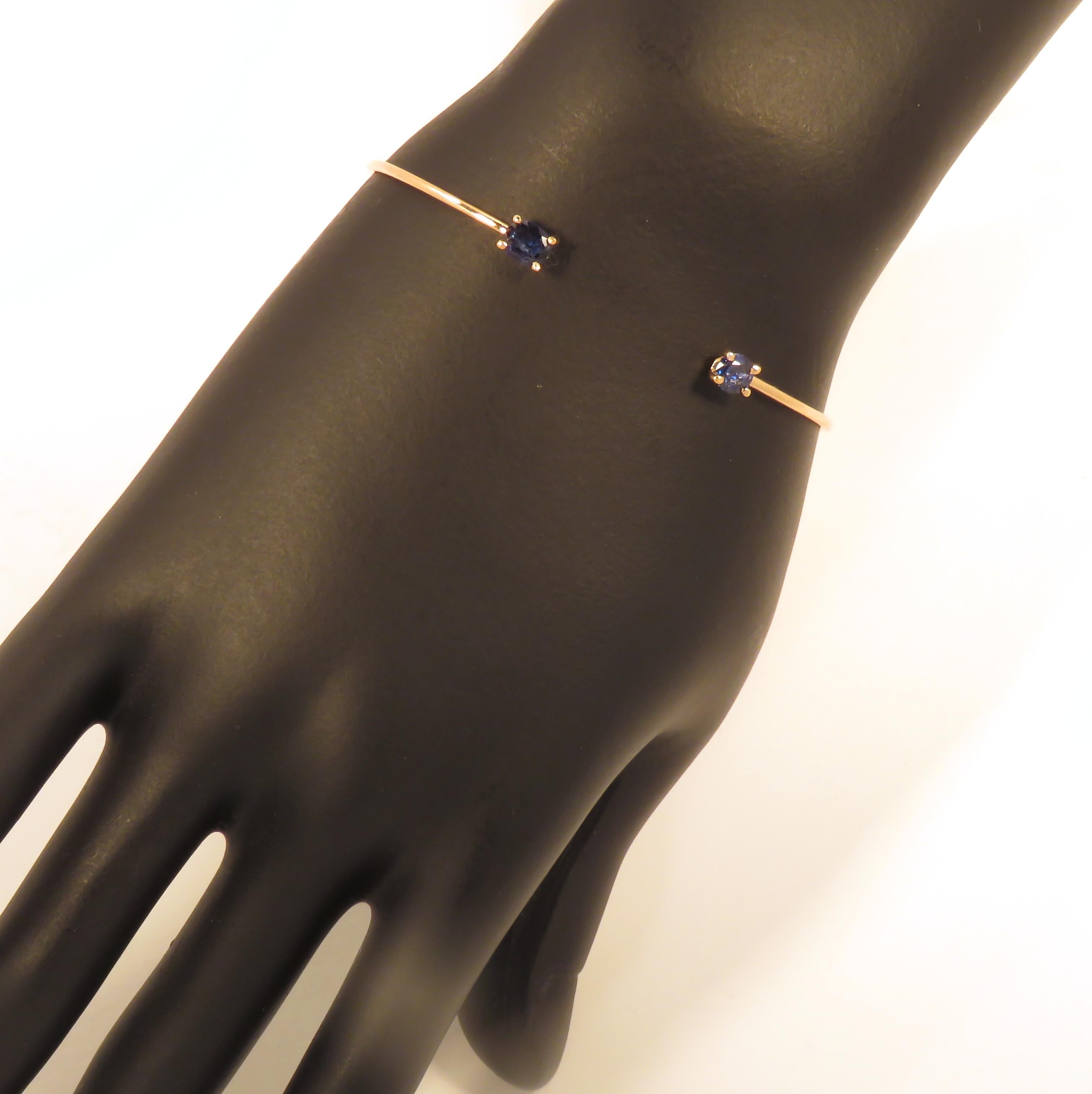 Beautiful cuff bracelet crafted in 9 karat rose gold featuring 2 oval cut sapphires. The inner size is 58x45 mm /  2.283x1.771 inches. Marked with the Italian gold mark 375 and Botta Gioielli brand mark 716MI.
Search Ref:  LU126214022182 in my