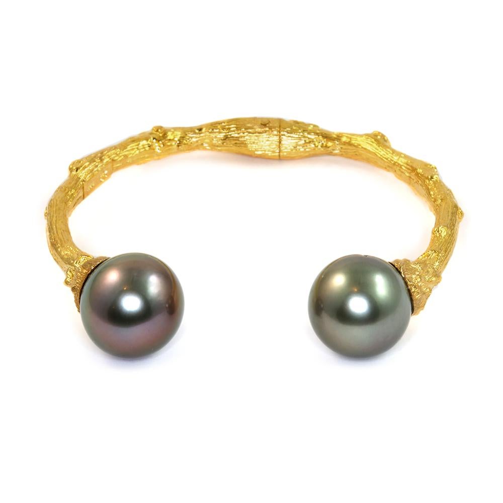 Channeling the eternal Tree of Life, the organic spirit of K. Brunini is captured through this Large Cuff in 18k Yellow Gold artfully capped with 14mm+ Tahitian Pearls. Because every pearl is unique, each cuff is a one-of-a-kind work of art. 

In