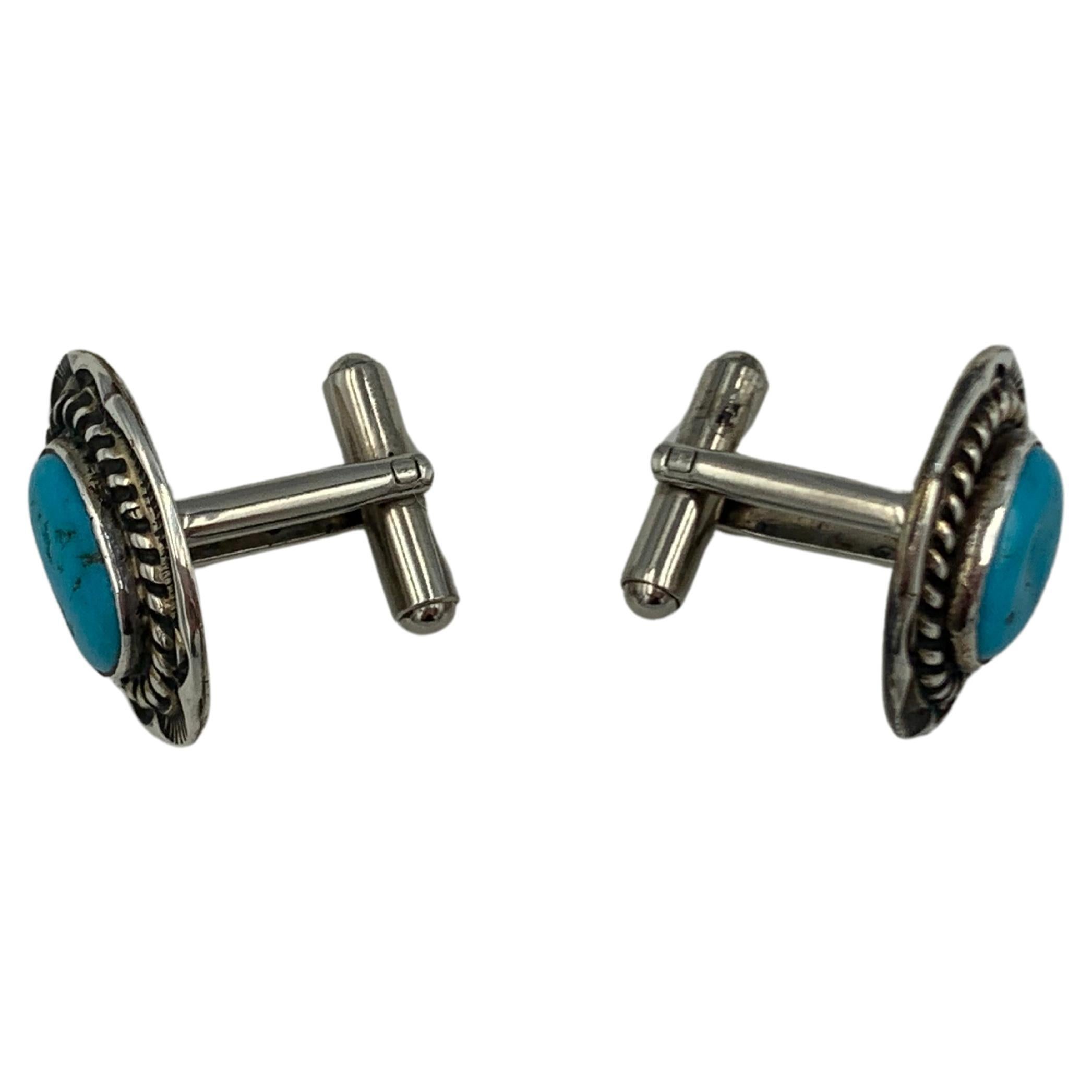 Cuff Links with Kingman Turquoise Gemstone by Navajo silversmith Dan Oliver.

About the artist: Dan Oliver, resident Navajo silversmith at Shades of the West, creates original American Indian jewelry exclusively for Shades of the West and Bischoff’s