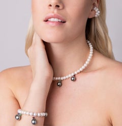 Cuff with white freshwater pearls, Tahiti pearls and gemstones