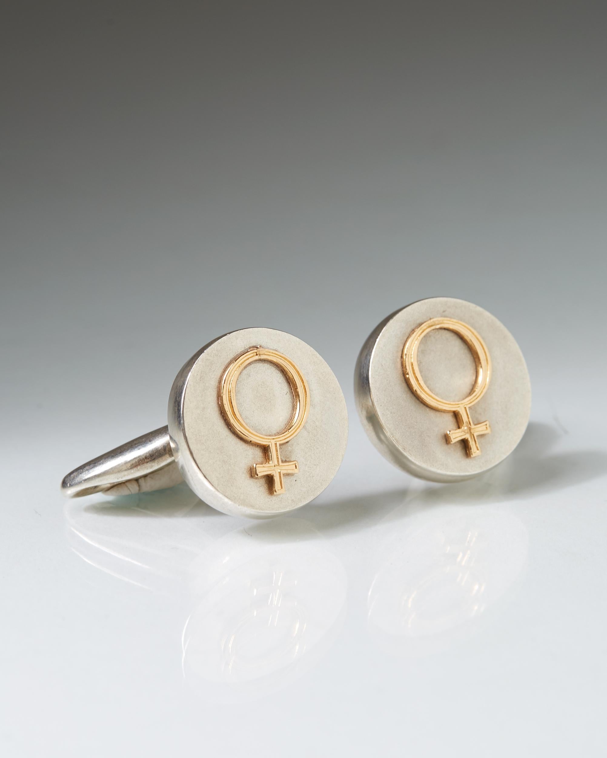 Sterling silver and 18 ct gold.

D: 2 cm/ 3/4''