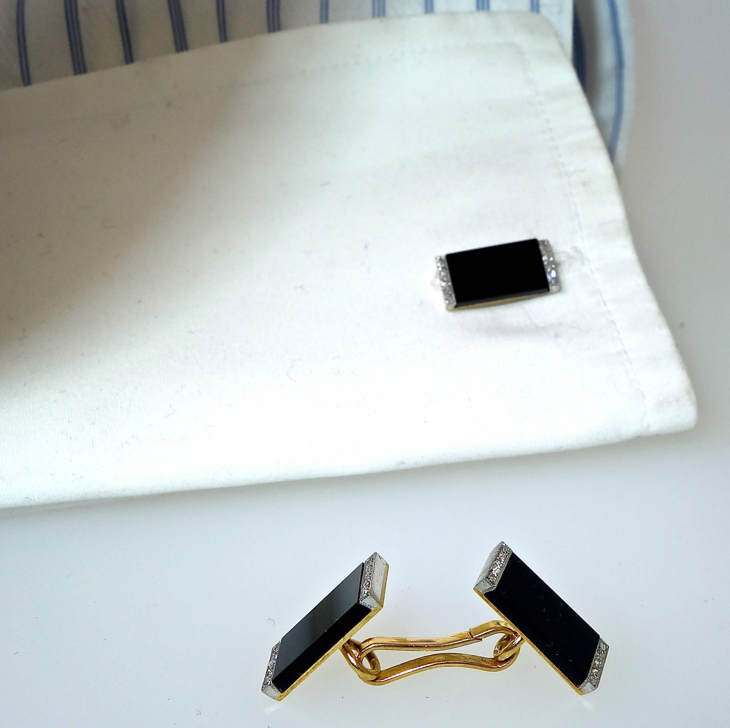 Art Deco back to back cufflinks.  Ghiso, the famous French house made these back to back 18K cufflinks, circa 1925.  Onyx panels are bordered with 30 rose cut diamonds set in platinum.  Well made, (this type of linked center is a favorite as they