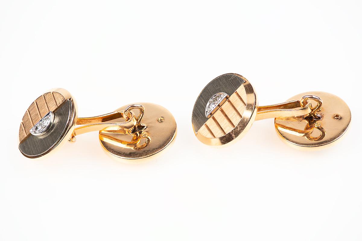 1930’s vintage Art Deco double sided cufflinks of fine colour and condition. Created half in 18 karat yellow gold and half in 18 karat white gold, both with a brushed finish. The white gold is set with two brilliant cut diamonds and the yellow gold