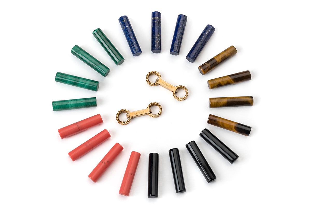 Vintage Van Cleef & Arpels double sided baton cufflink set in 18 karat yellow gold. There a choice of five coloured stone batons in this set, lapis lazuli, onyx, coral, malachite and tigers eye. Mix and match to create further options in wear.