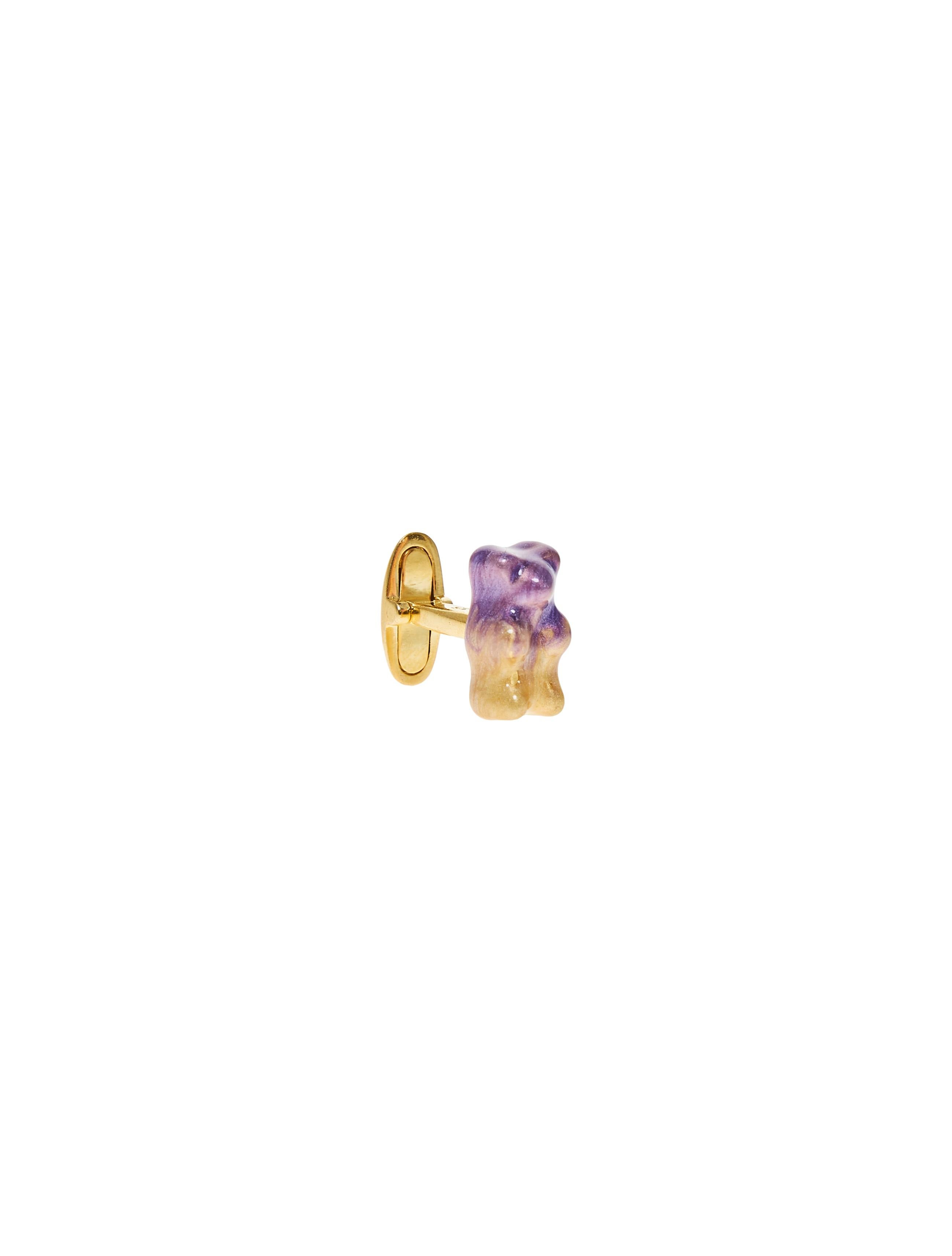 18K gold plated silver gummy bear cufflinks with transparent Red  enamel coverage. 

The Gummy Project by Maggoosh is a capsule collection inspired by the designer's life in New York City and her passion for breakdancing and other street arts.