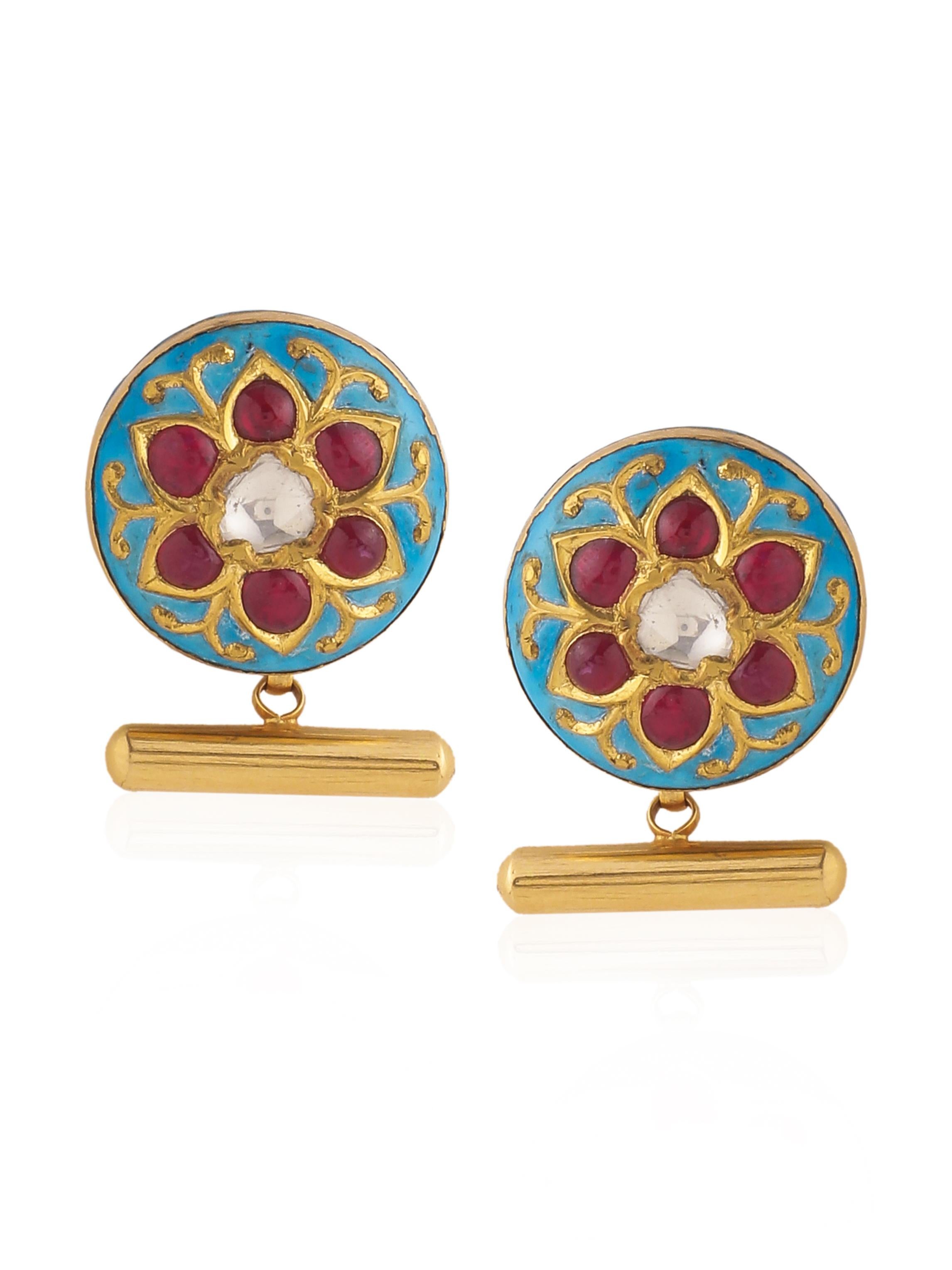 A pair of beautiful cufflinks with diamonds, rubies and fine turquoise and red enamel work.
The flat diamonds in the centre are called 