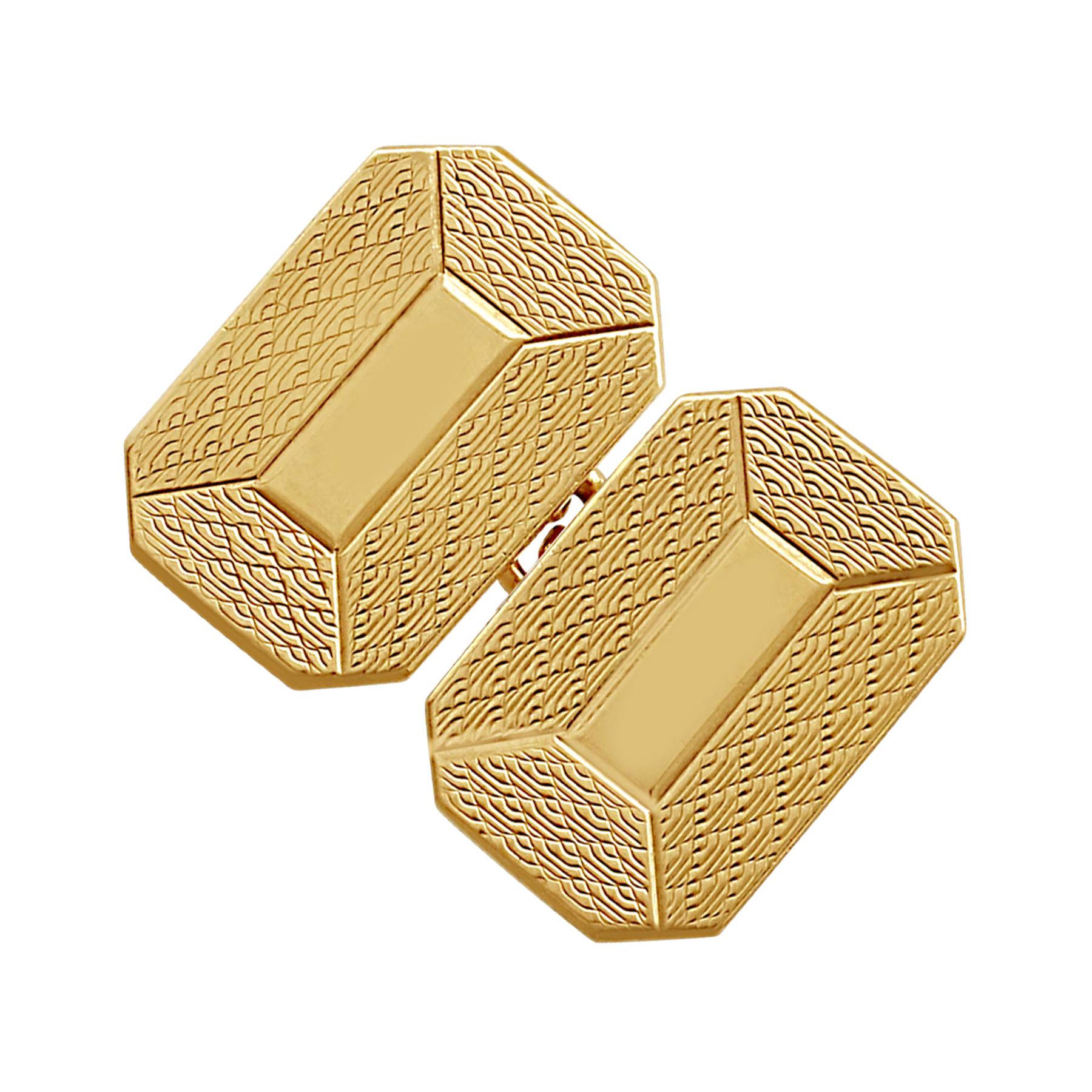 A fine and impressive pair of vintage English 9 karat yellow gold cufflinks; an addition to our men's jewelry and estate jewelry collections.

These vintage cufflinks have been crafted in 9k yellow gold.

The cufflinks have a rectangular cut