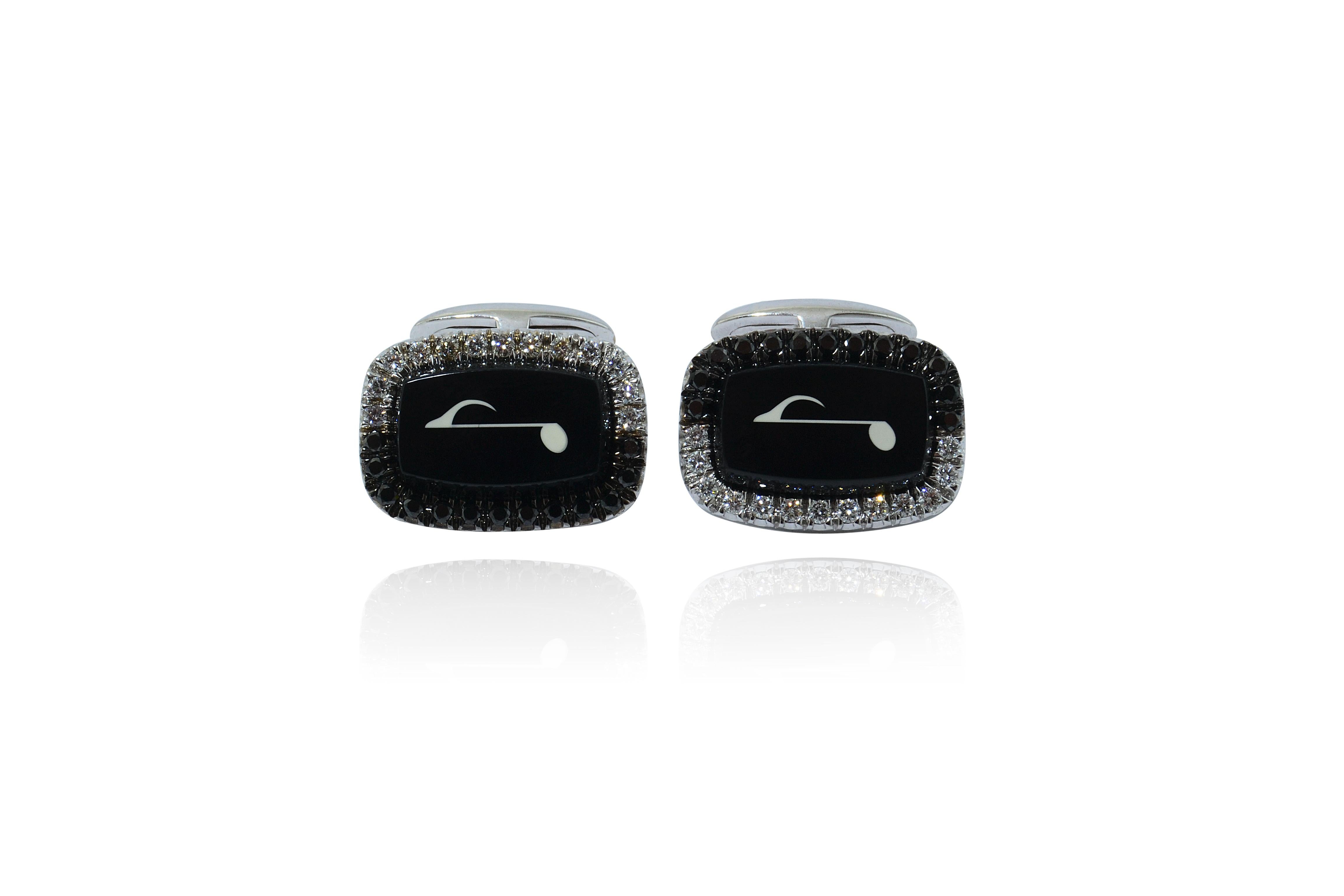 Handcrafted in Italy, the pair of cufflinks features a onyx base centering a design made by round colorless diamonds and one black diamonds

Cufflinks w gold g 17,50 - n.26 diam. ct 0,49 - n.26 black diam. ct 0,53 - onix g 3,37

the T bar is plane