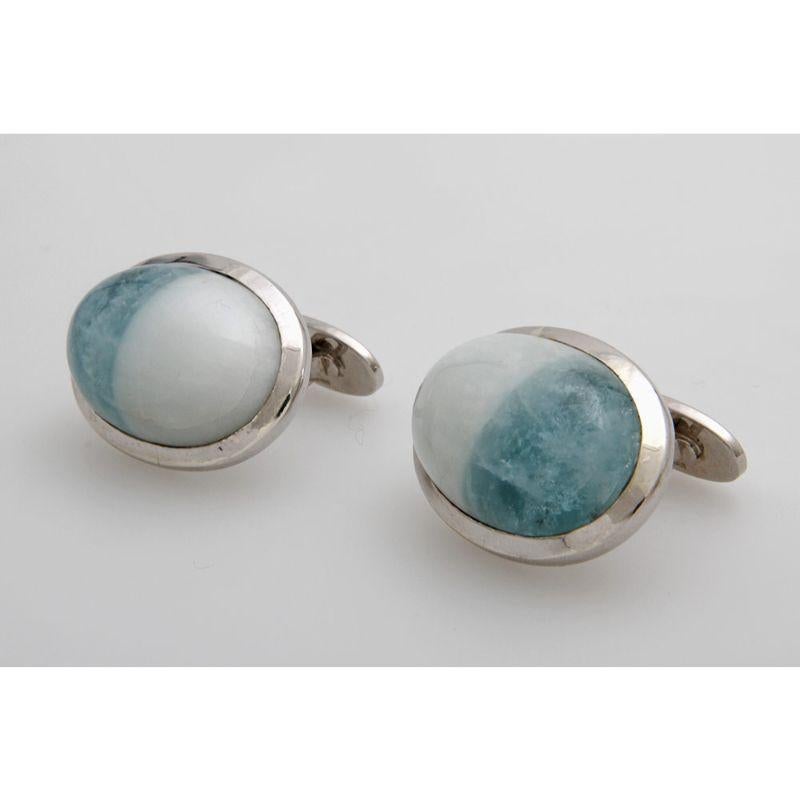 Cufflinks (Pair). Especially with 2 aquamarine cabochons in the bedrock 109.83 cts. Sterling silver, rhoninated. Handwork.
