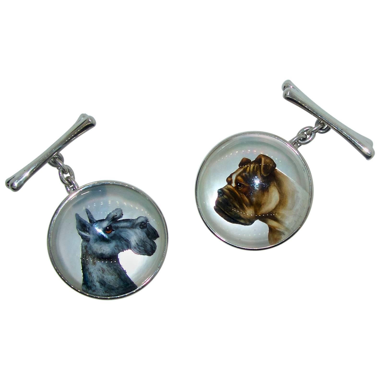 Cufflinks with Essex Crystals, these cufflinks are of  finely painted dogs on mother of pearl and placed under Rock Crystal, these cufflinks are platinum with platinum dog bone elements as the other side of the paintings.  Rarely do we find such